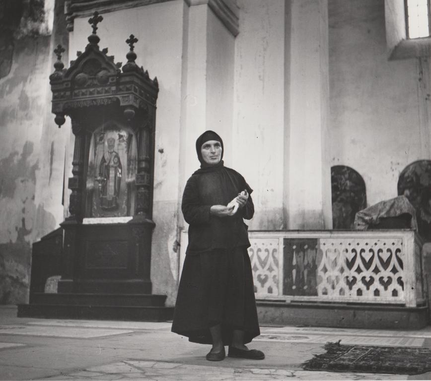 Robert Capa Portrait Photograph - Untitled (Russian Peasant Woman in Church)