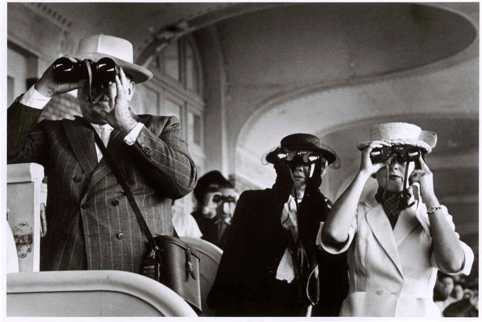 Robert Capa Black and White Photograph – Watching the horse races with binoculars, Deauville, Frankreich