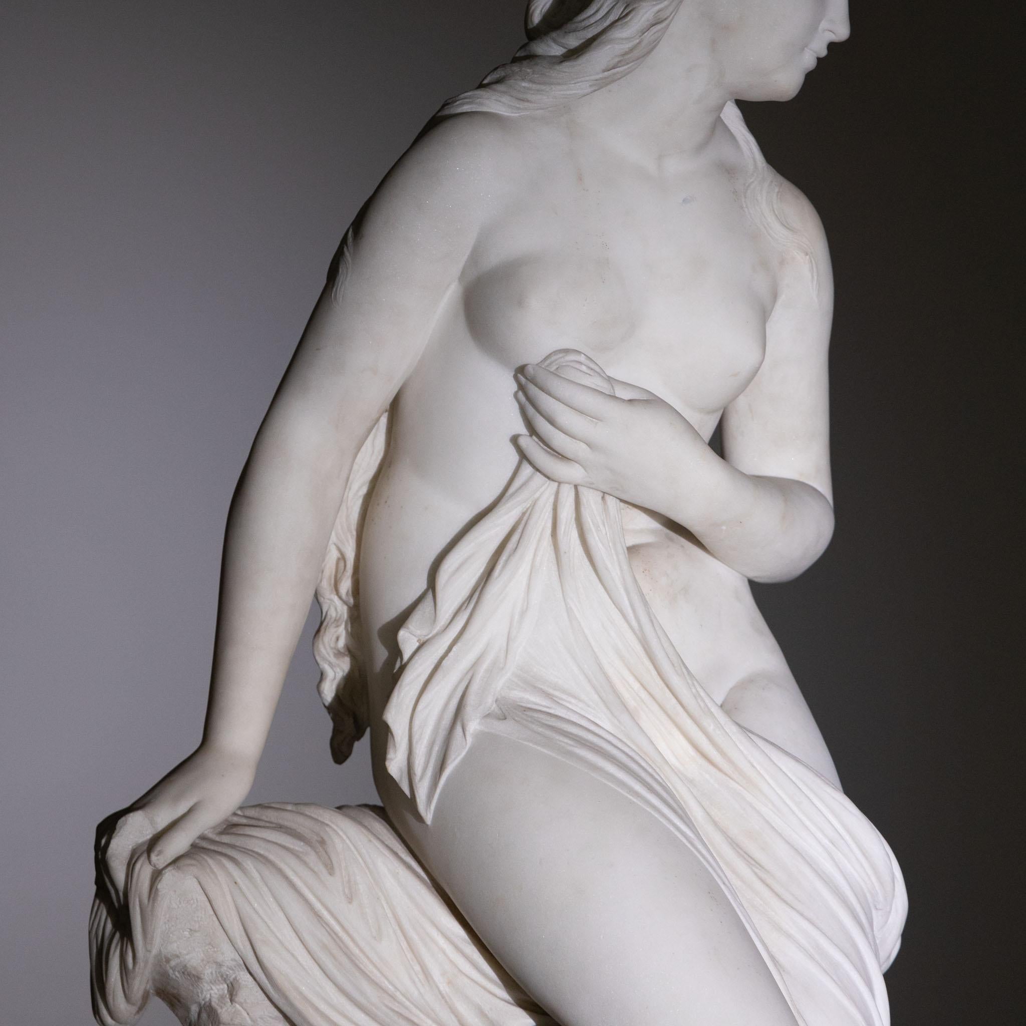 Almost life-size depiction of Venus with dolphin by Robert I Cauer (1831-1893). Full sculptural execution in marble. Inscription on the base 