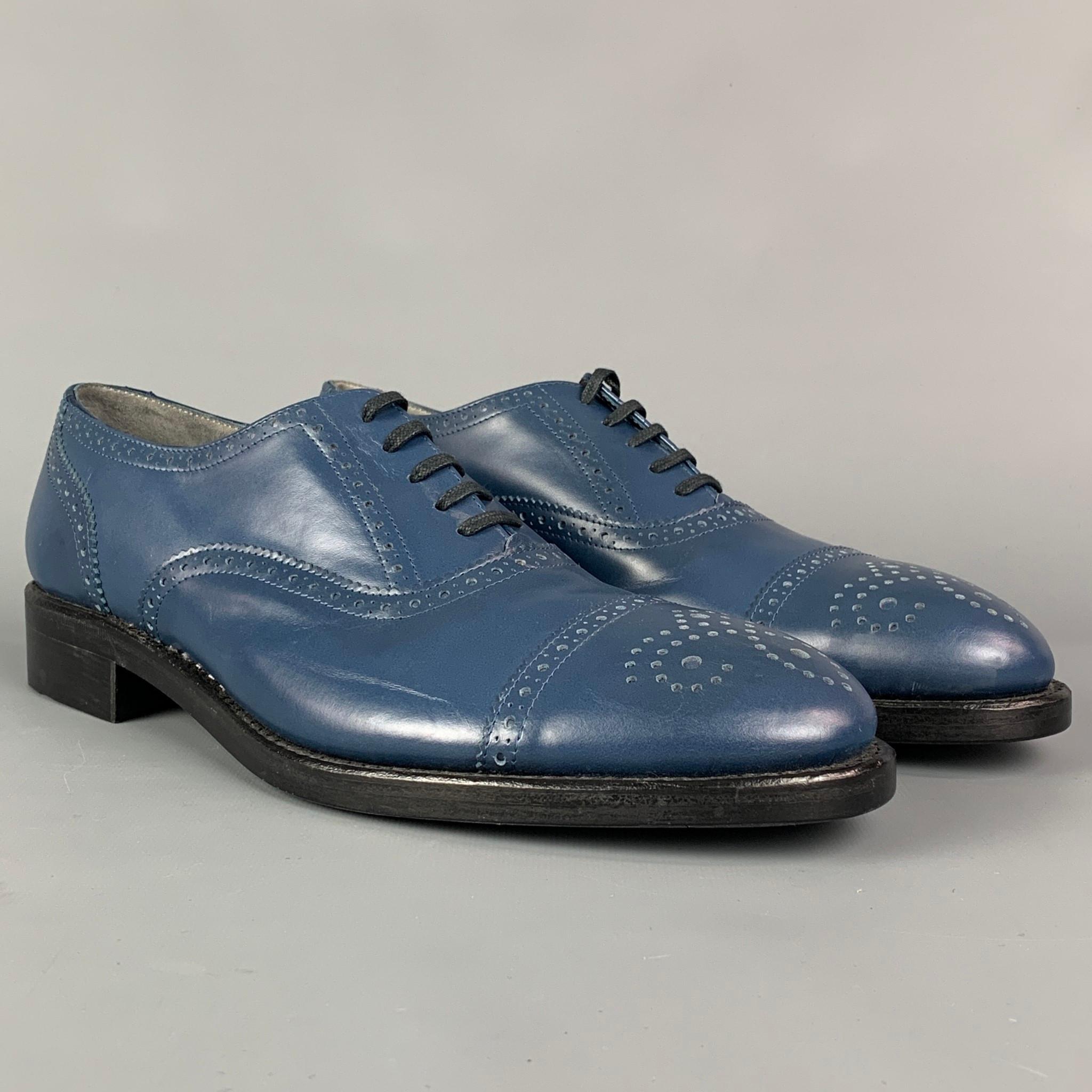 ROBERT CLERGERIE for J. FENESTRIER shoes comes in a blue perforated featuring a cap toe, leather sole, and a lace up closure. Made in France.

Very Good Pre-Owned Condition.
Marked: 42.5 E 01 0951 24

Outsole: 12 in. x 4 in. 