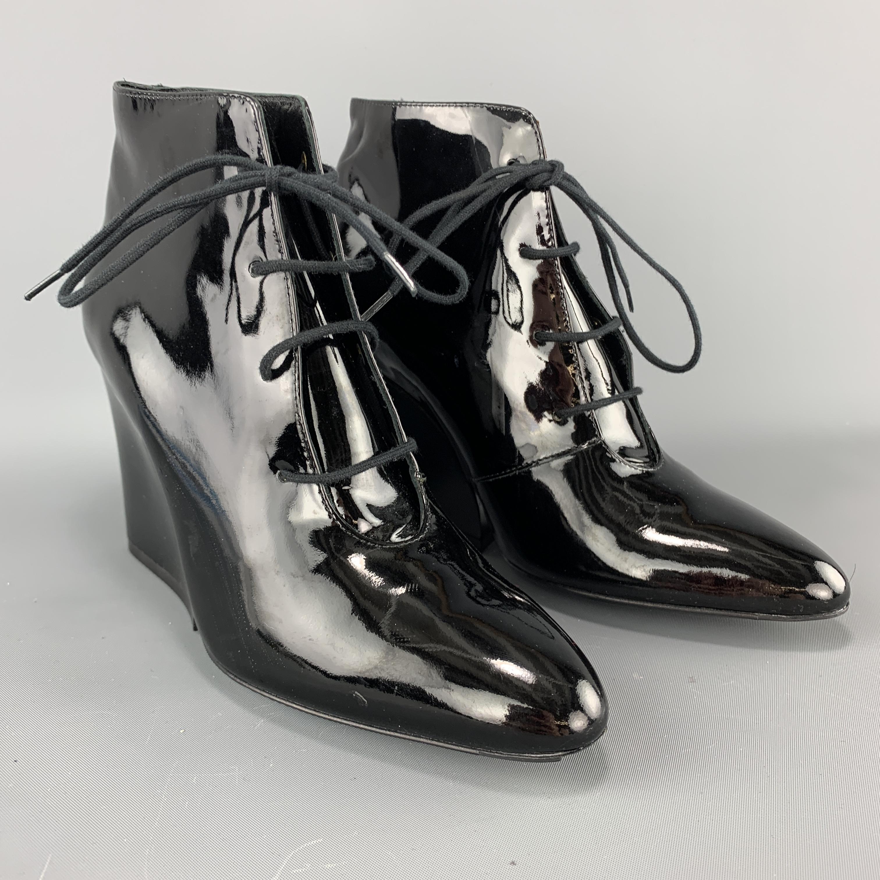 ROBERT CLERGERIE ankle booties come in black patent leather with a pointed toe, lace up front, and chunky stacked heel. Never work but imperfection on sole. Made in France.

Brand New. 
Marked: 6

Heel: 3.5 in.
