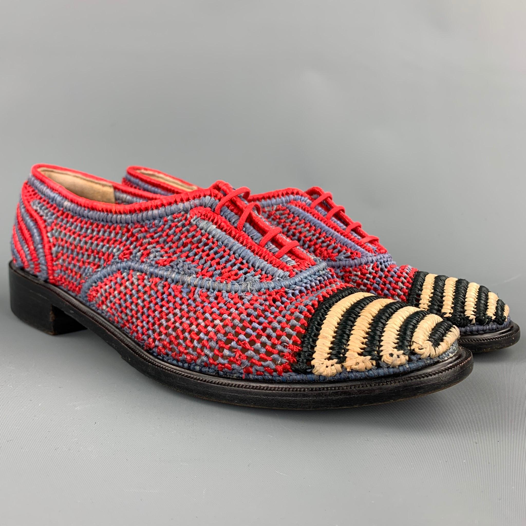 ROBERT CLERGERIE moccasins comes in a red & blue hand woven raffia with a striped woven toe design featuring a wooden sole and a lace up closure. 

Very Good Pre-Owned Condition.
Marked: 37.5 

Outsole:

10 in. x 3 in. 
