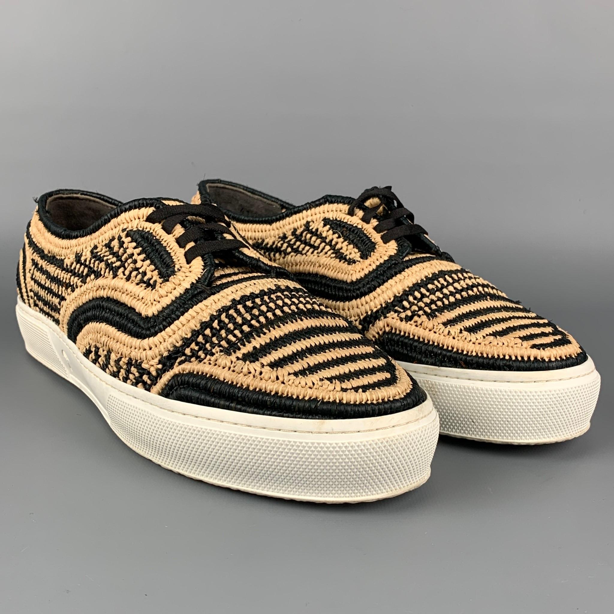 ROBERT CLERGERIE sneakers comes in a black & natural wove material featuring a rubber sole and a lace up closure. 

Excellent Pre-Owned Condition.
Marked: 41

Outsole: 11 in. x 3.75 in. 