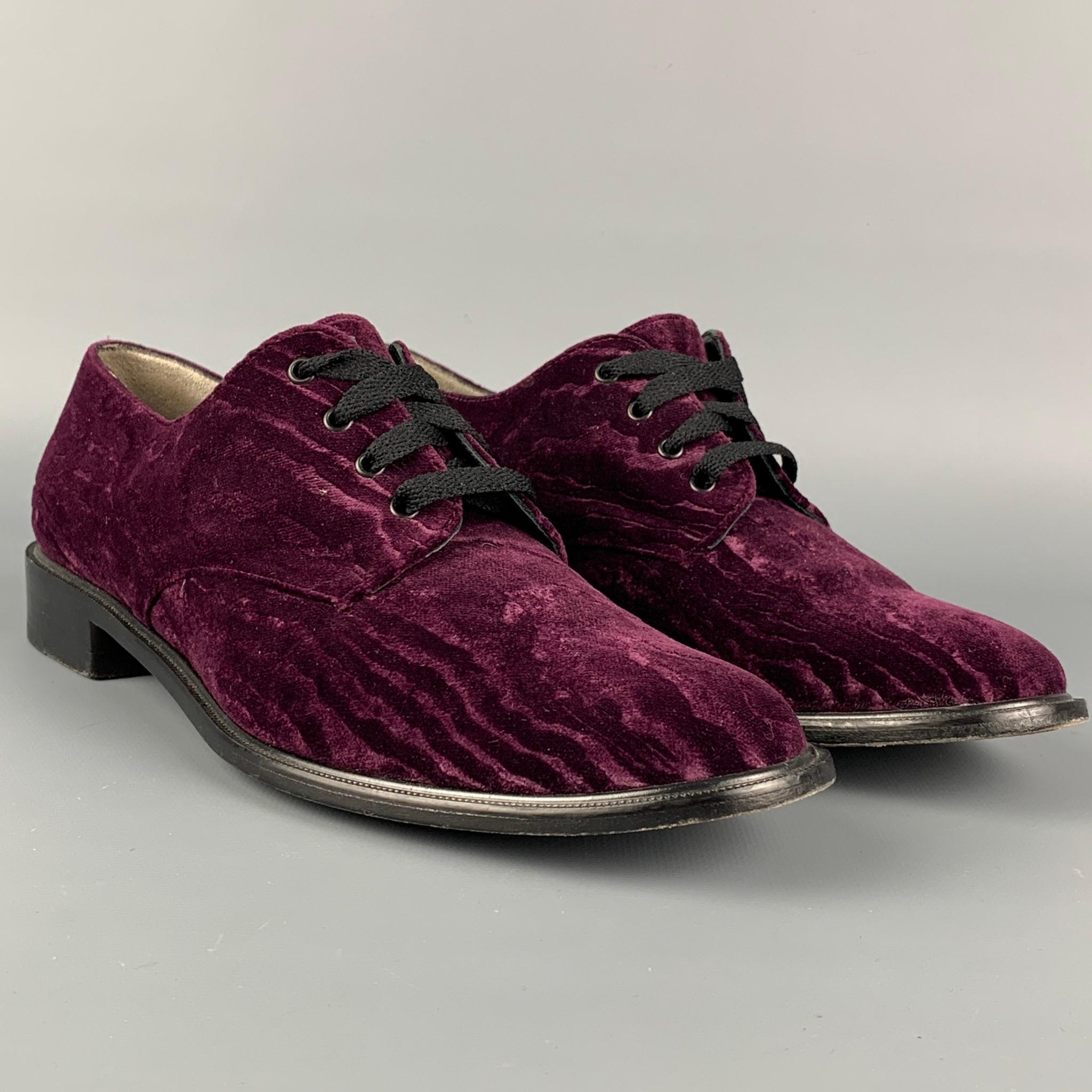 ROBERT CLERGERIE shoes comes in a purple jacquard velvet featuring a classic style and a lace up closure. Made in France. 

Very Good Pre-Owned Condition.
Marked: 38.5

Outsole: 10.75 in. x 3.75 in. 