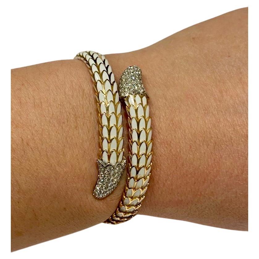 This chic open cuff cobra bracelet features 1.25 total carats of Round Brilliant cut Natural diamonds in 18 karat Rose  gold and 18 karat white gold. A collection of sixty-four (64) near colourless diamonds decorate the 18K white gold tail ends of
