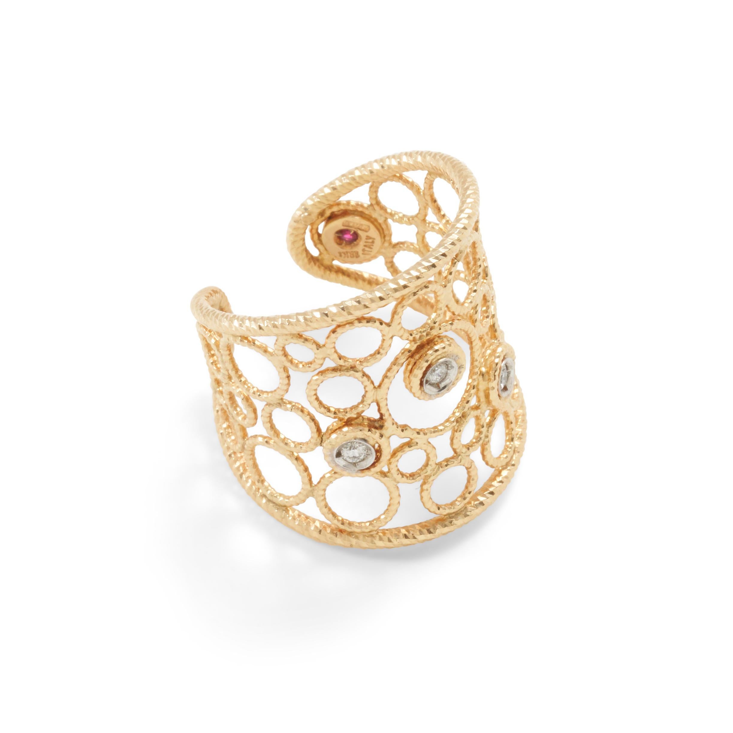This Roberto Coin Bollicine ring is designed as a cuff ring with three full cut diamonds set in 18K yellow gold. Signed with Roberto Coin Ruby Signature. 
Size 7.5. The Ring is flexible so it could be enlarged or tightened.  

