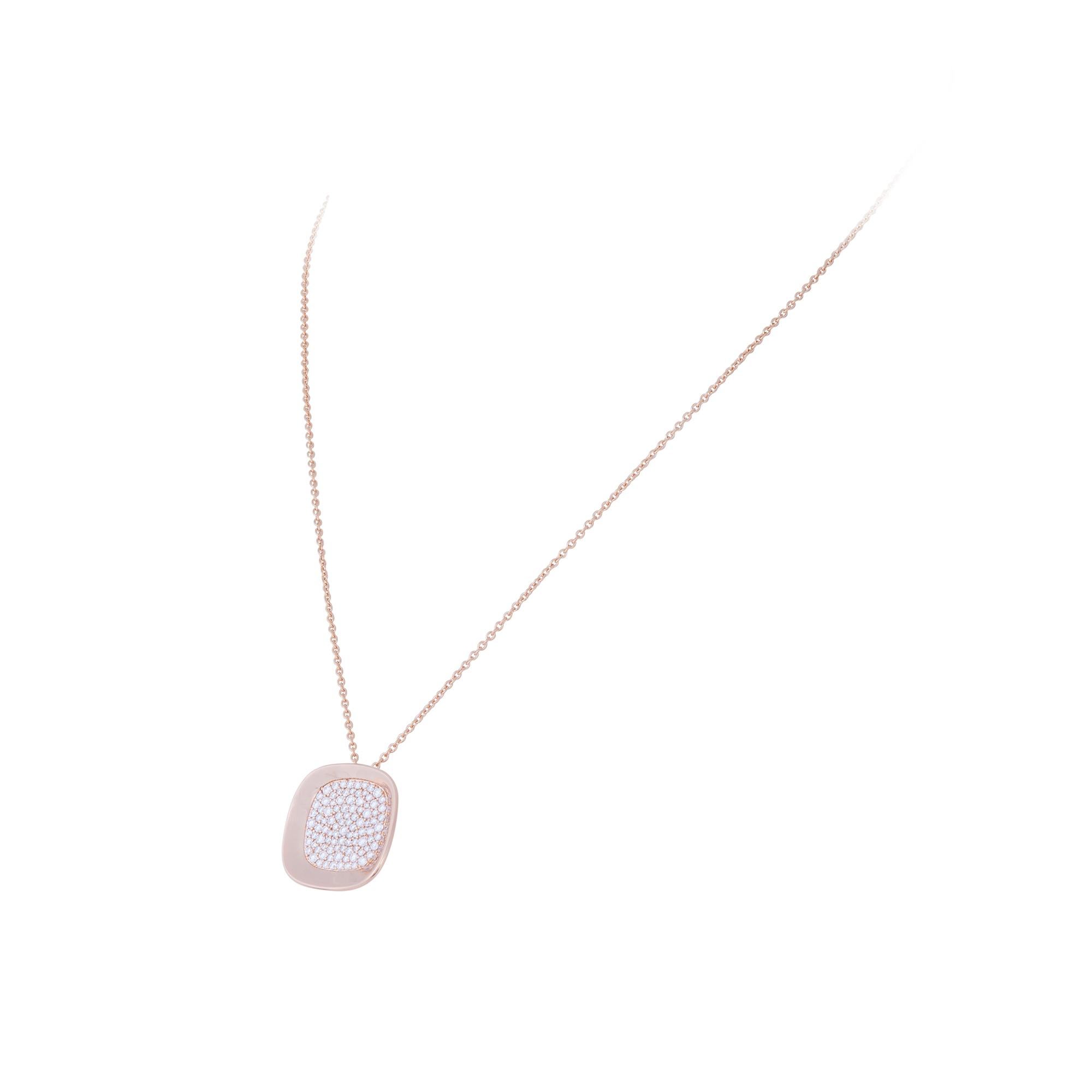 Authentic Roberto Coin necklace from the Carnaby Street collection crafted in 18 karat rose gold.  The high polished gold pendant is pave set with approximately 0.88 carats of round brilliant cut diamonds and hangs from an adjustable chain measuring