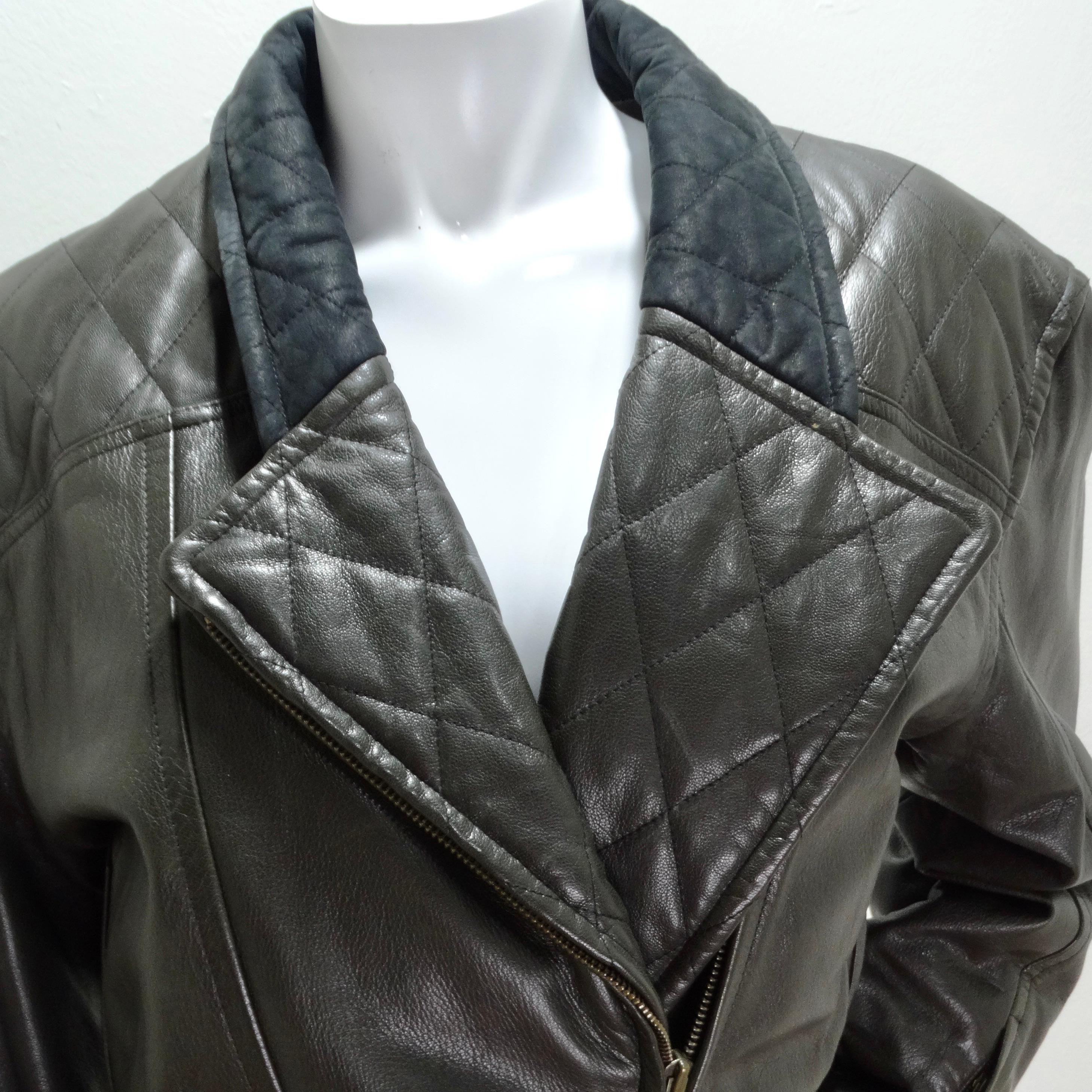 Introducing the Robert Comstock 1980s Grey Belted Leather Moto Jacket—an extraordinary and timeless piece that effortlessly marries structure with luxury. This moto-style leather jacket isn't just an article of clothing; it's a wearable work of art