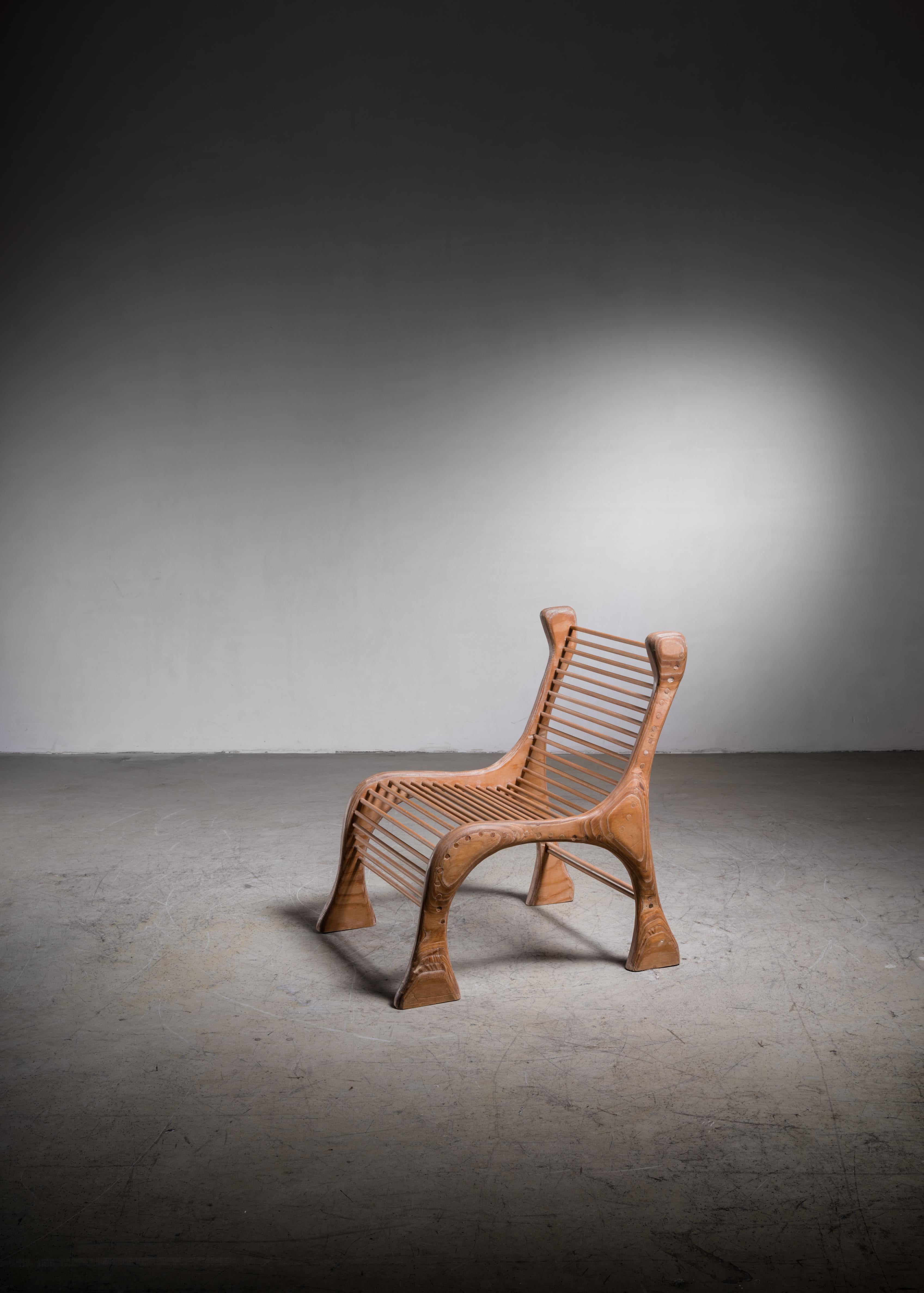 A studio crafted, sculptural lounge chair by American woodworker Robert Dice. The chair is made of a laminated frame in Finland birch with an amazing organic structure and maple dowels that form the seat and backrest.