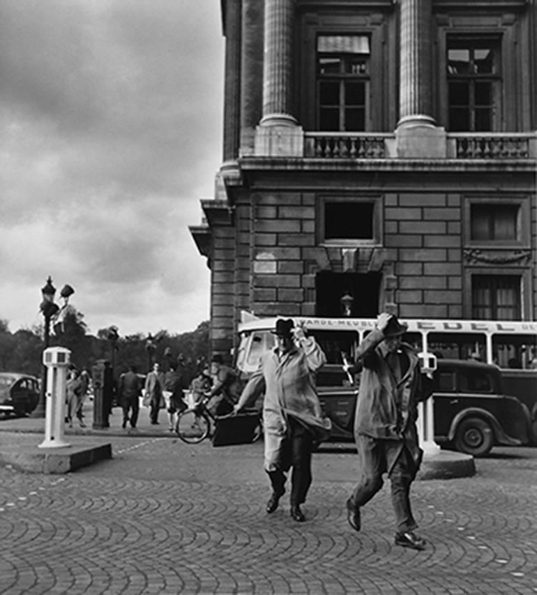 Robert Doisneau Black and White Photograph - Coup de Vent Rue Royale