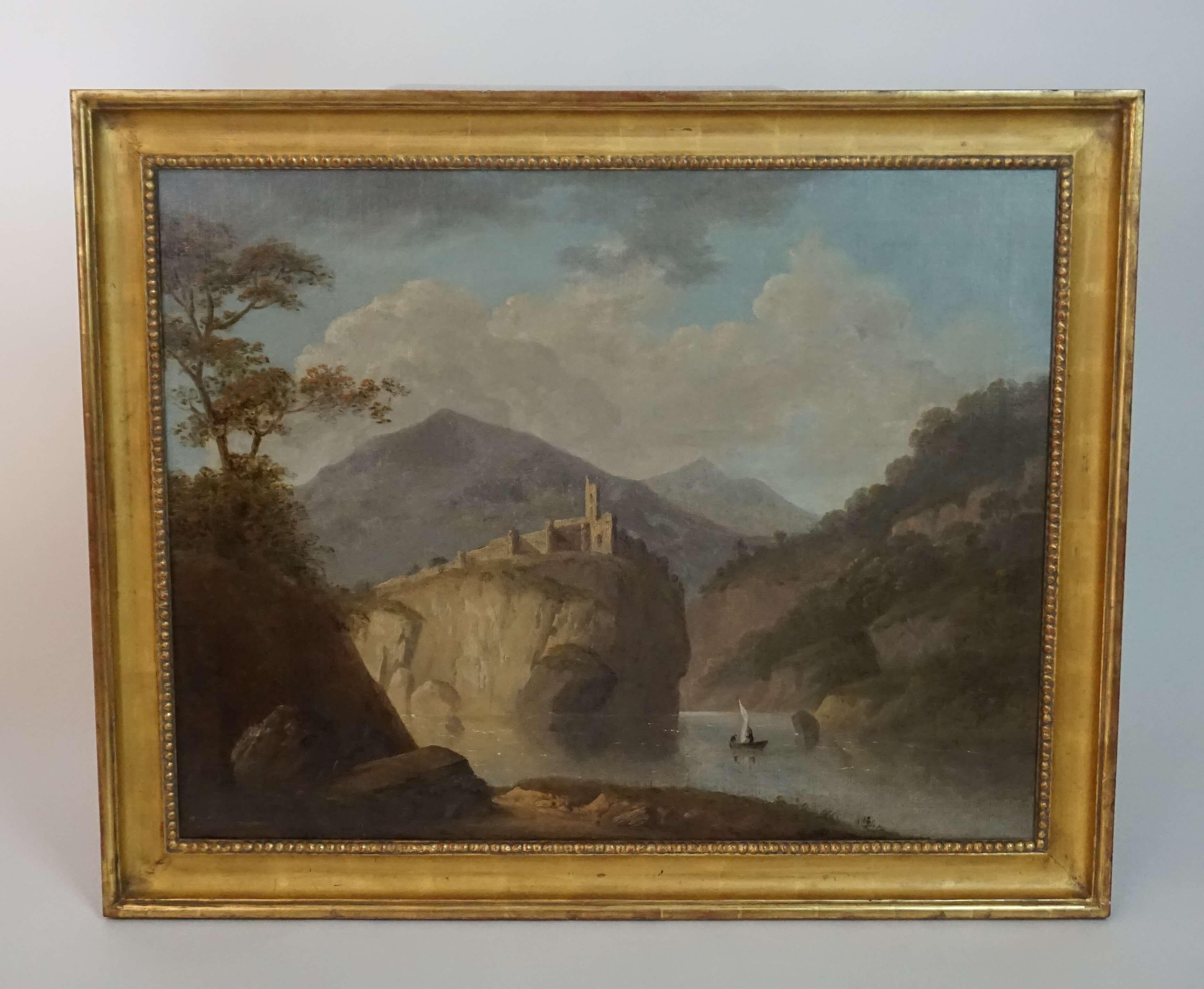 Oil on canvas painting by prominent British landscape painter Robert Freebairn (signed lower left) depicting a dramatized view of Dolbadarn Castle rising above lake Llyn Peris with Mount Snowdon in the background, circa 1795. Canvas measures 36