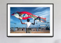 Fly to the Sky.  Boy Holding Big Bird in the Bronx