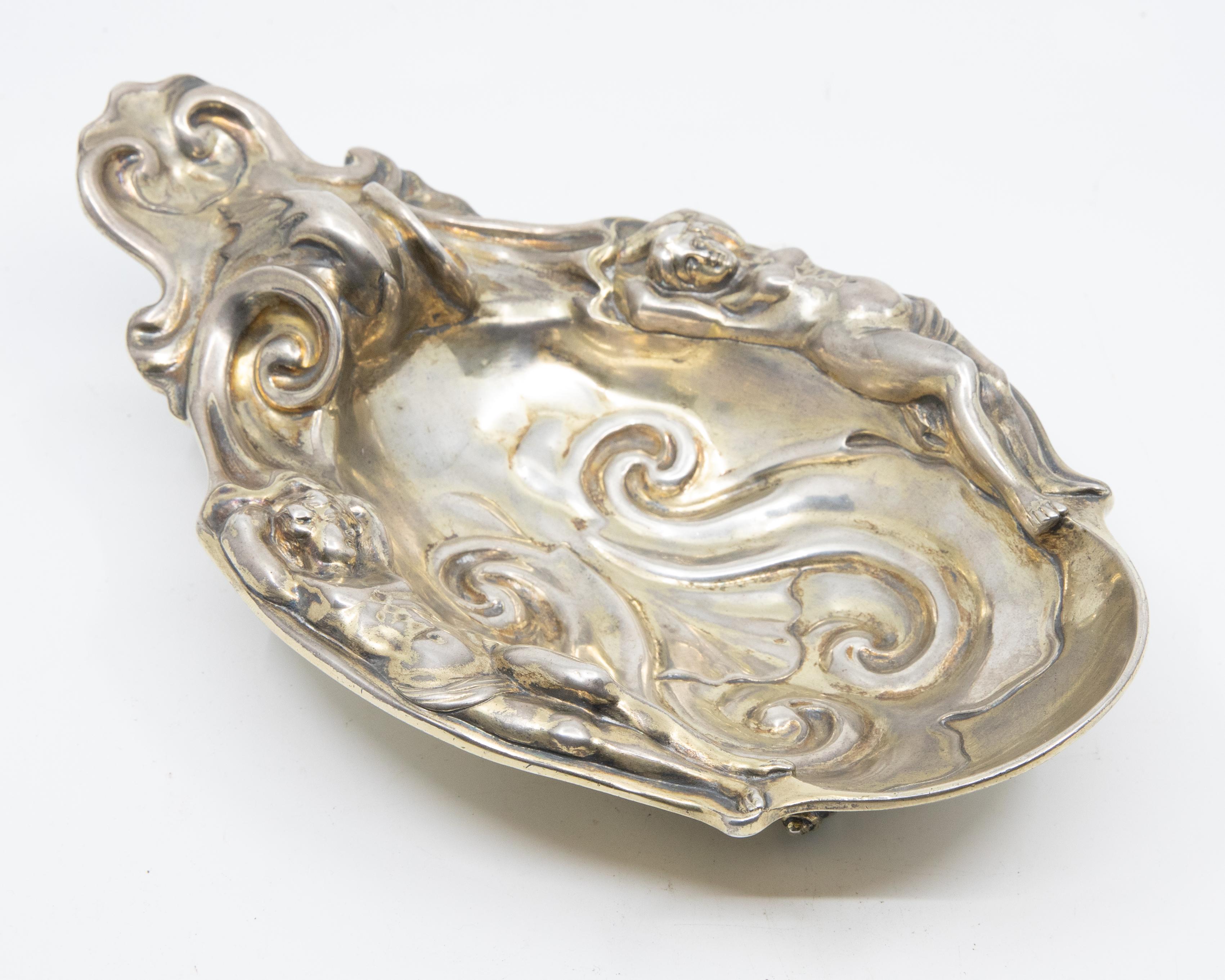 Offered is an extremely rare Renaissance Revival, Robert Garrard gilt over sterling silver dish decorated with nude male and female figures. The piece is marked sterling, R & S Garrard, London and dated for 1873. The company that was to become