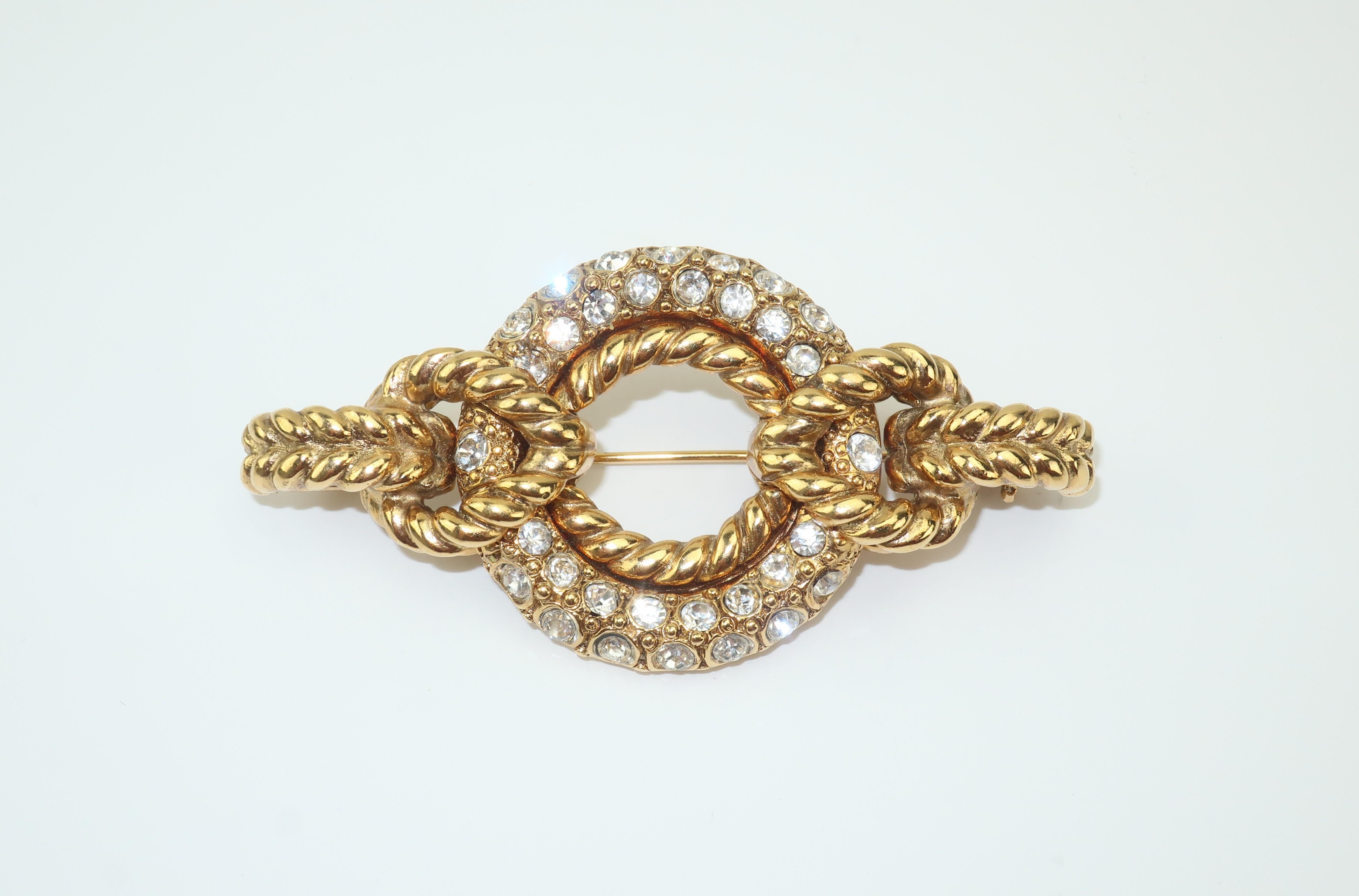 Robert Goossens is a name synonymous with the opulent costume jewelry produced for great Parisian fashion houses such as Chanel and Yves Saint Laurent.  This 1980's brooch is a nice example of his stylish work with a chunky statement making gold