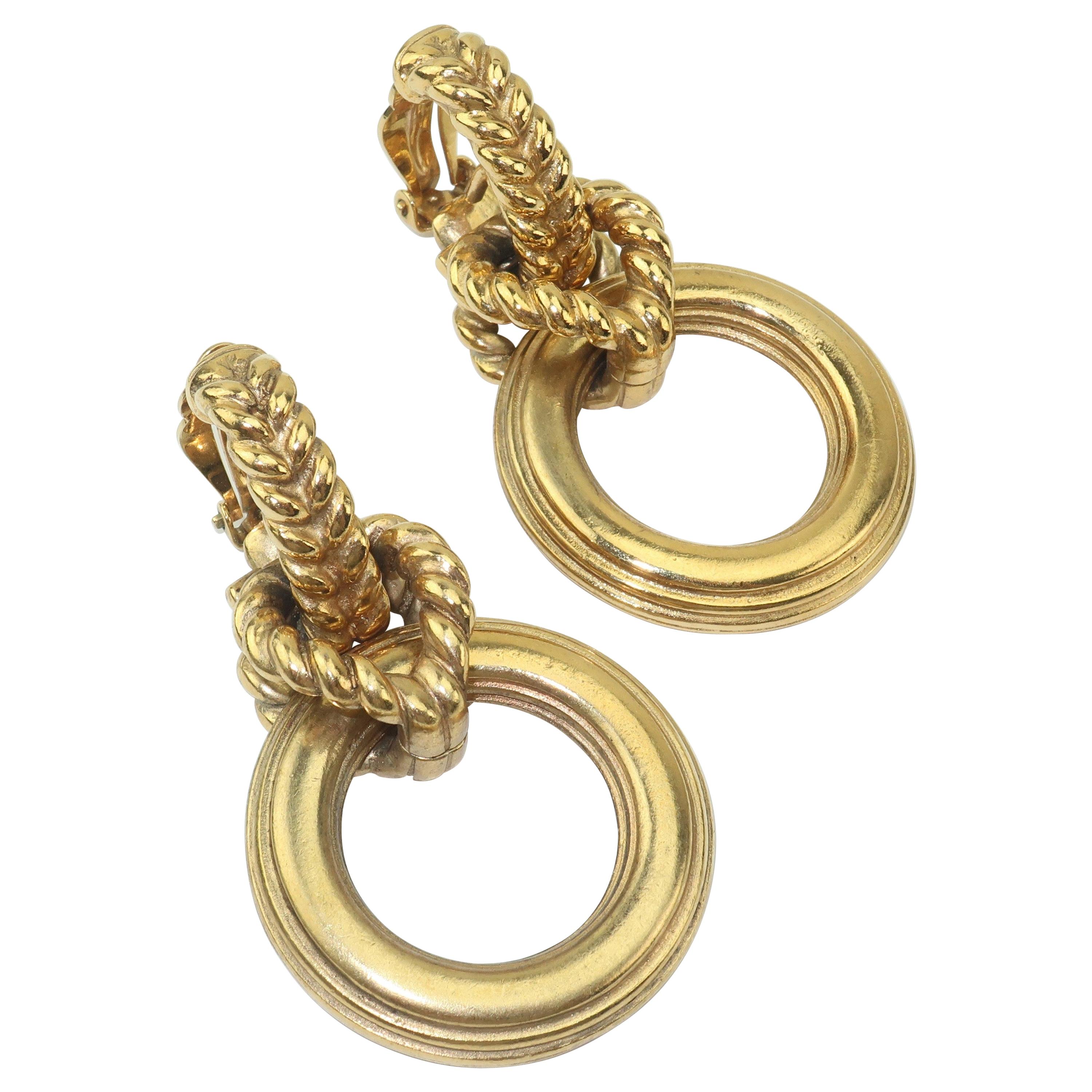 Robert Goossens is a name synonymous with the opulent costume jewelry produced for great Parisian fashion houses such as Chanel and Yves Saint Laurent. These 1980's door knocker earrings are a nice example of his stylish work with a chunky statement
