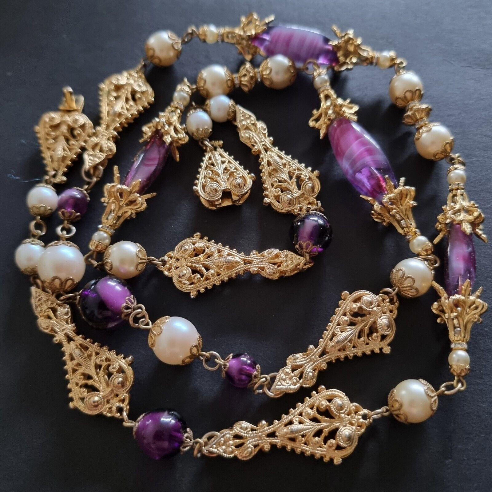 Beautiful old NECKLACE,
50s vintage,
by High Fashion designer Robert GOOSSENS,
length 94 cm, weight 84 g,
extraordinary work, exceptional quality,
golden metal, glass beads,
good condition.

Robert Goossens was born in 1927 in Paris. His mother is