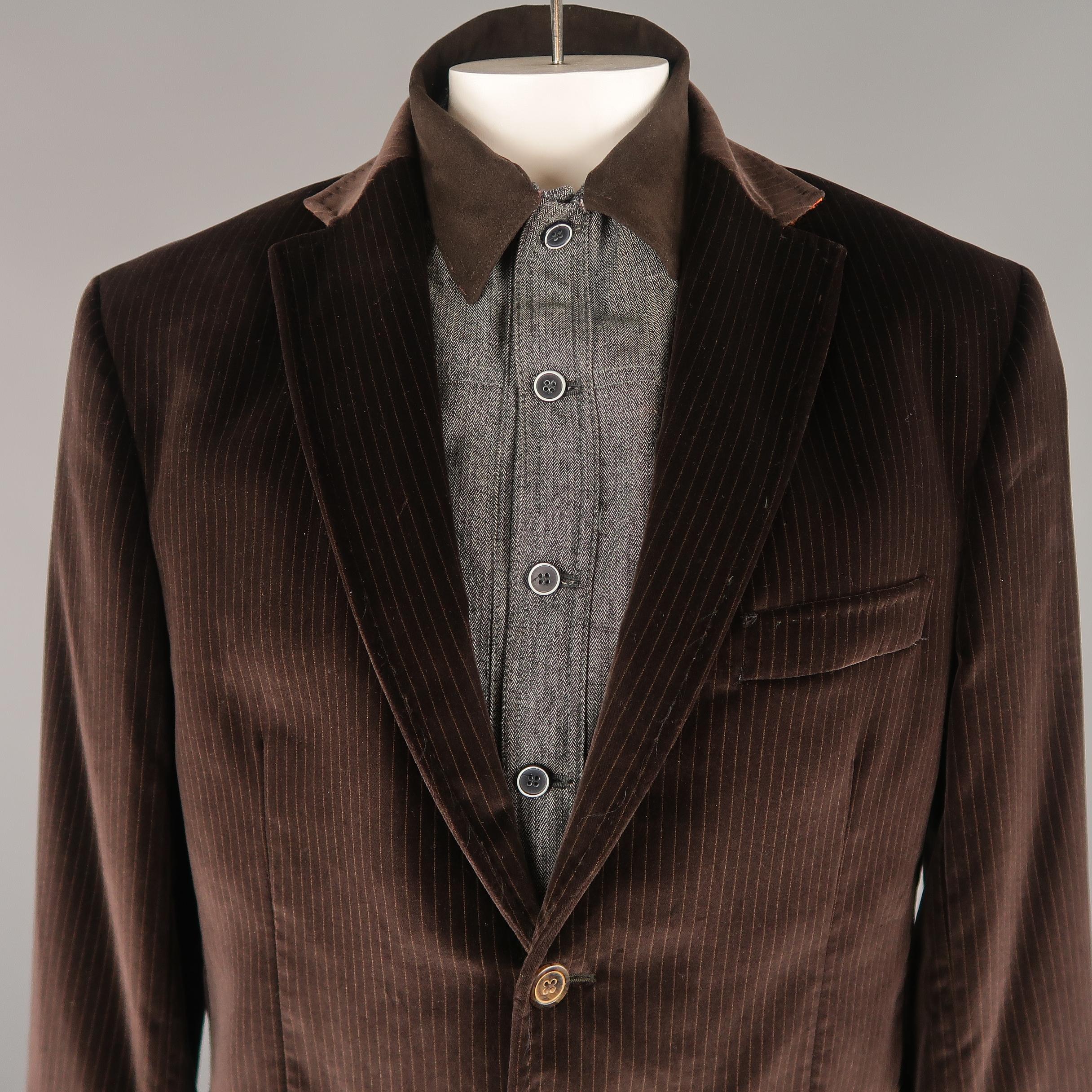 ROBERT GRAHAM Jacket comes in a brown tone in a striped velvet material, with a simulate inner layer, a notch lapel, slit and flap pockets, 2 buttons at closure, single breasted, buttoned cuffs, and a single vent at back. Made in Italy.
 
Excellent