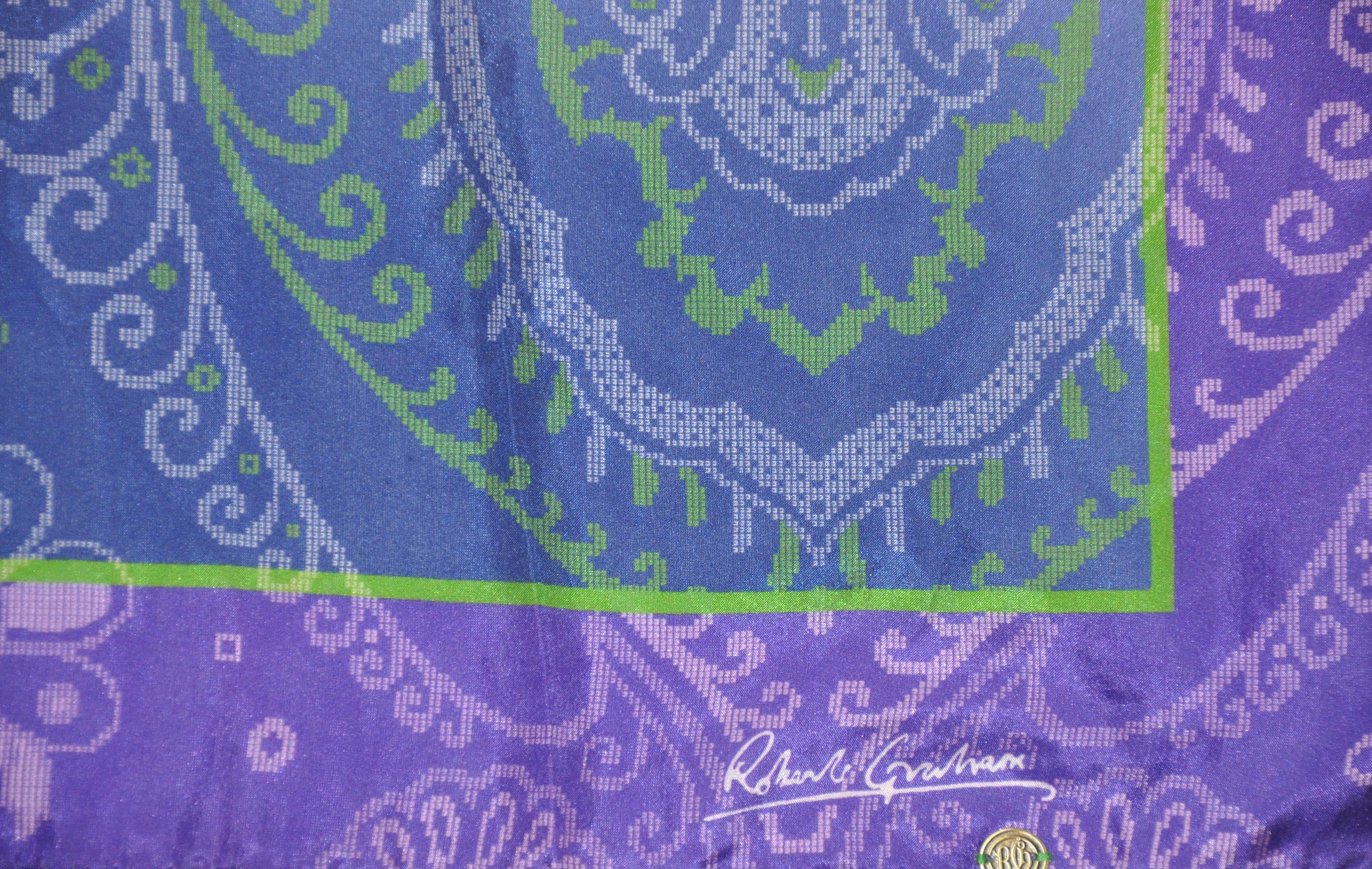       Robert Graham wonderful shades of violets and lavender palsey silk handkerchief accented with hand-rolled edges, and measures 16 inches by 16 1/2 inches. Made in Italy.