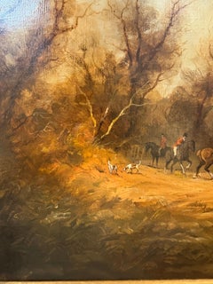 English fox hunting scene with fox hounds, huntsman on horse back in a landscape