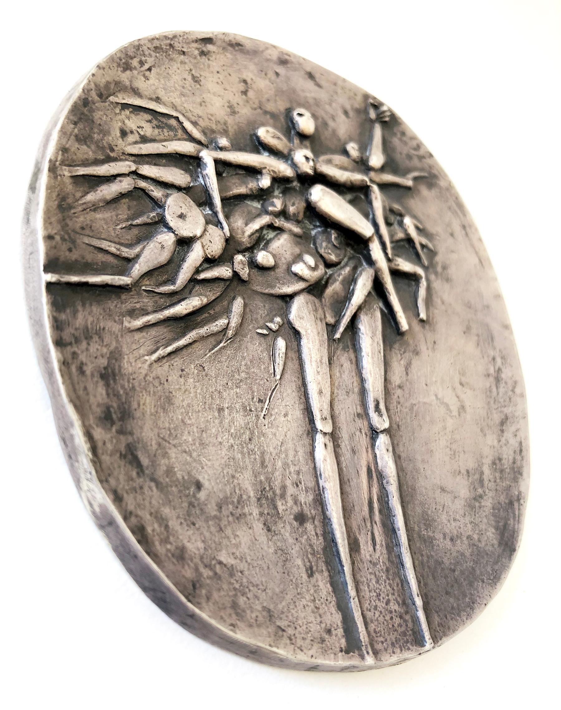 Sterling silver abstract figural bas relief plaque with built in hanging device created by Robert Hansen of Los Angeles, California. Piece measures 4.5