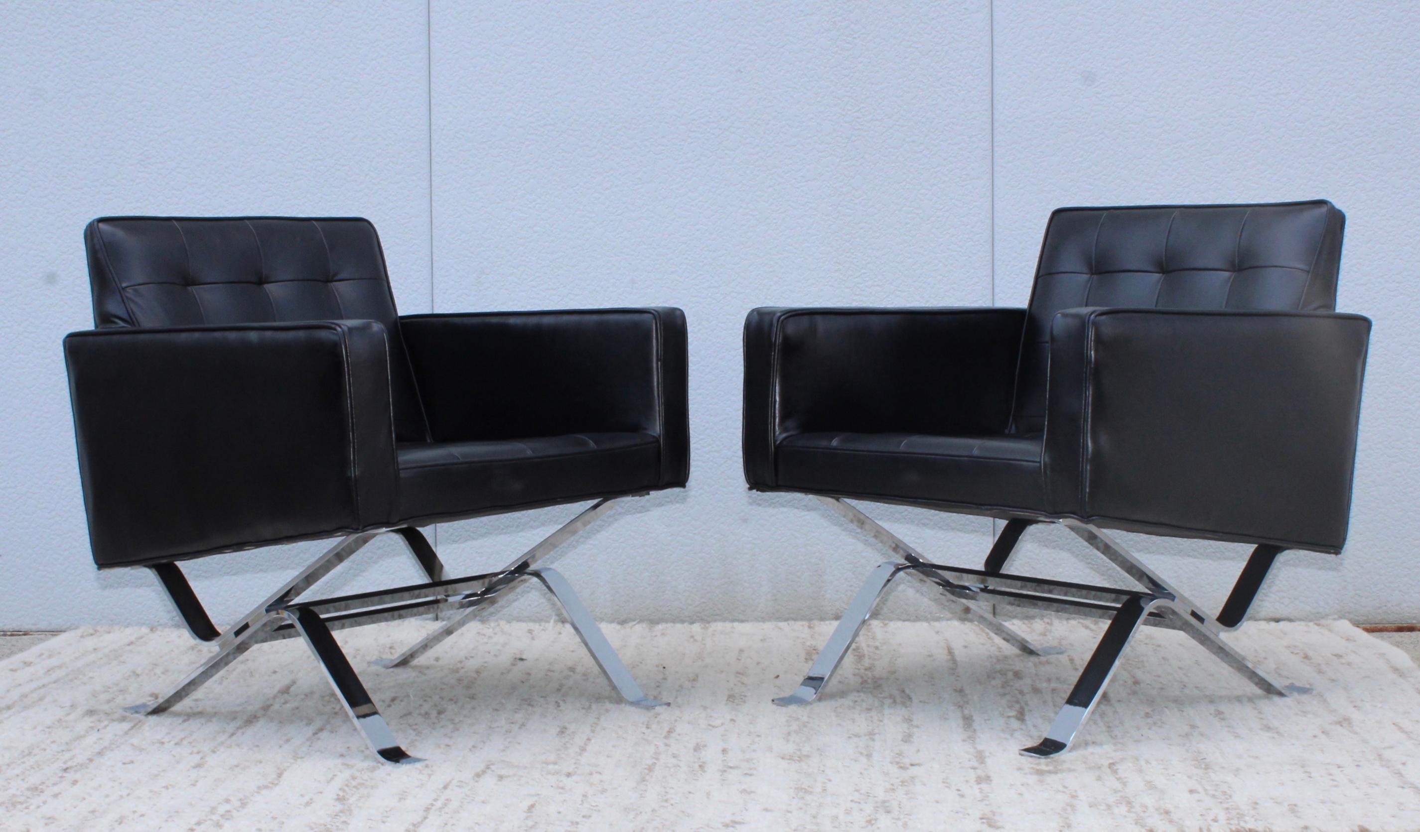 Stunning pair of 1960s chrome steel base with black leather upholstery lounge chairs by Robert Haussmann.