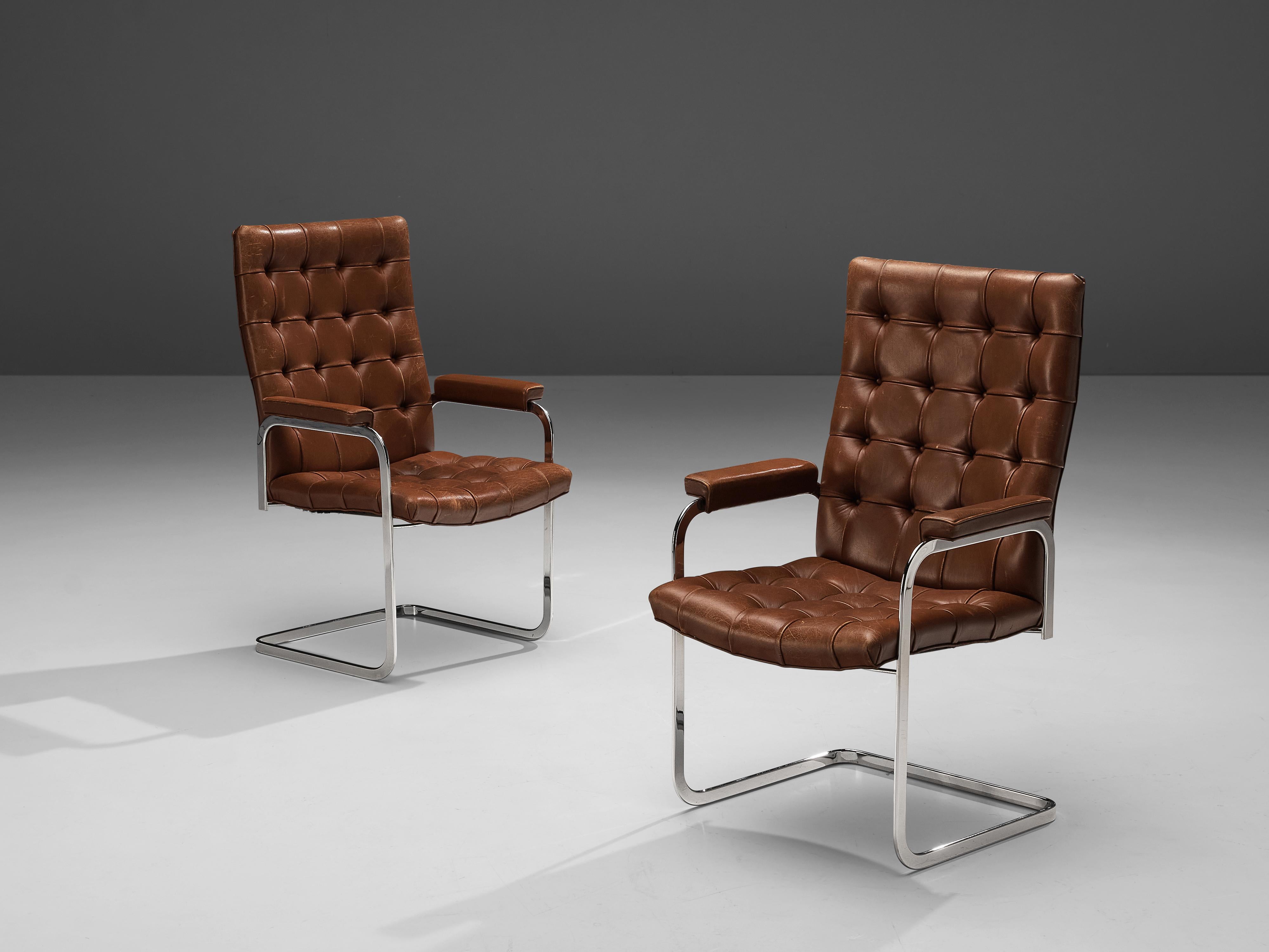 Robert Haussmann and De Sede, 'RH-304', brown leather, steel, Switzerland, 1950s

This cantilever tufted armchairs is designed by Robert Haussmann for DeSede. The set has a business aesthetic combined with a comfortable seat and back. This set