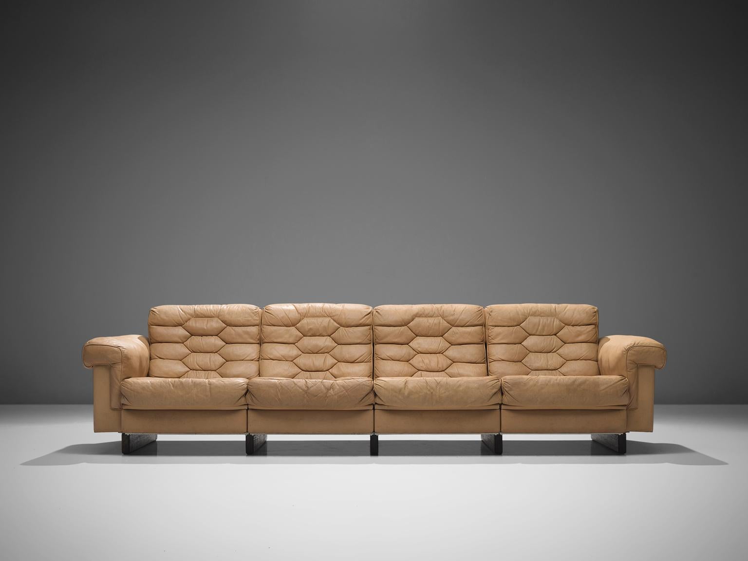 Robert Haussmann for De Sede, DS-P sofa, bright brown leather, 1960s

This sofa is designed by Robert Haussmann for De Sede. The pieces define themselves by honeycomb shaped tufted sections that are visible on seats and backs. The leather of this