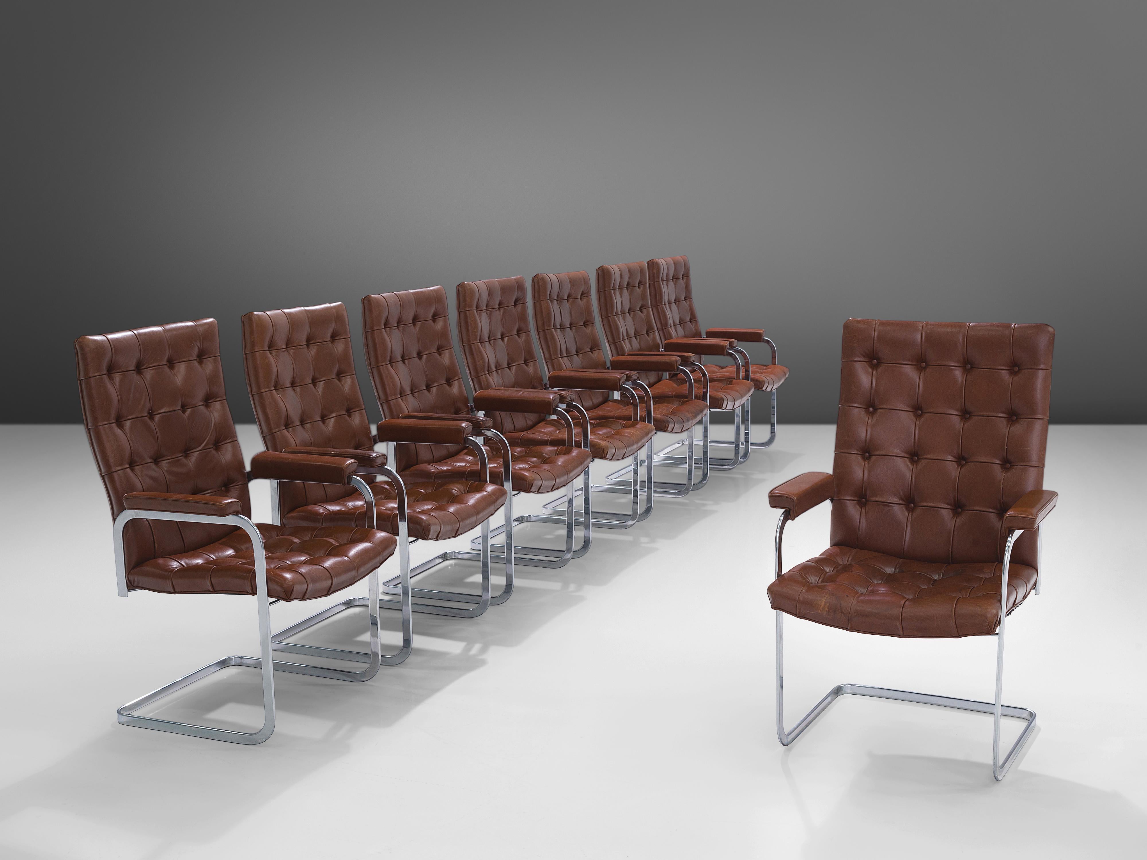 Robert Haussmann and De Sede, set of eight 'RH-304', brown leather, steel, Switzerland, 1950s

This cantilever set of tufted armchairs is designed by Robert Haussmann for DeSede. The set has a business aesthetic combined with a comfortable seat