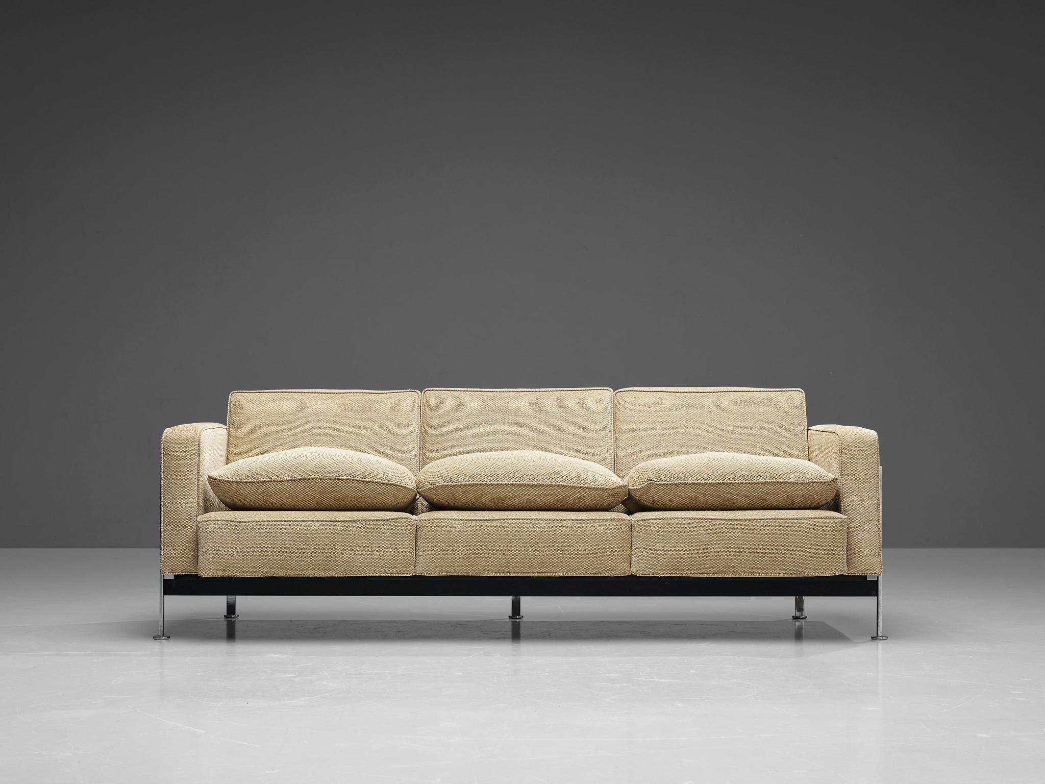 Robert Haussman for De Sede, three-seat sofa, fabric and chrome plated metal, Switzerland, design 1954. 

This comfortable three-seat sofa is designed by Robert Haussmann for De Sede and features a chromed frame that functions as a basket for the
