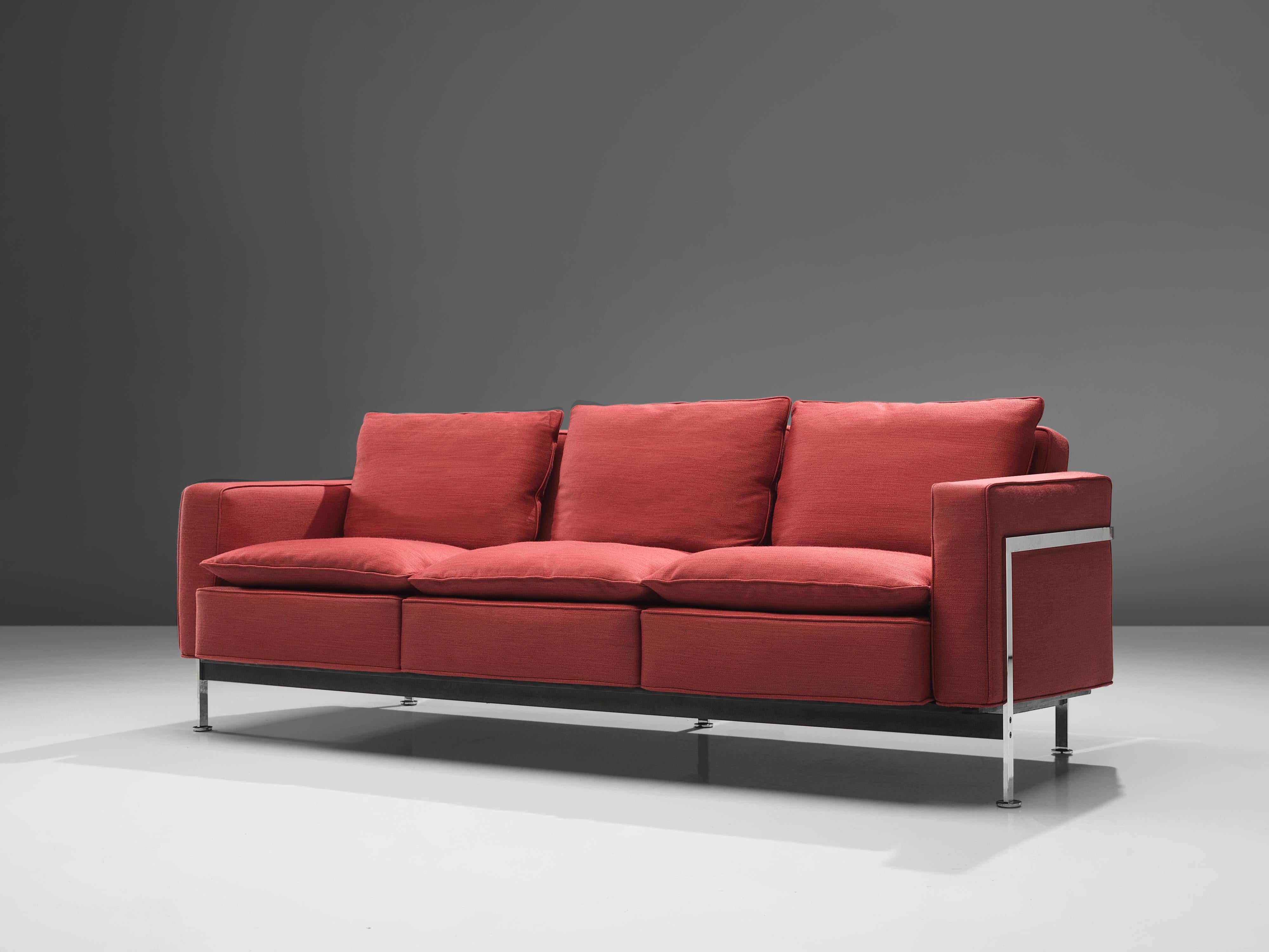 Robert Haussmann for De Sede, sofa model RH-302, metal, red upholstery, Switzerland, design 1954

This comfortable sofa is designed by Robert Haussmann for De Sede and features a chromed frame that functions as a basket for the cushions. The thick