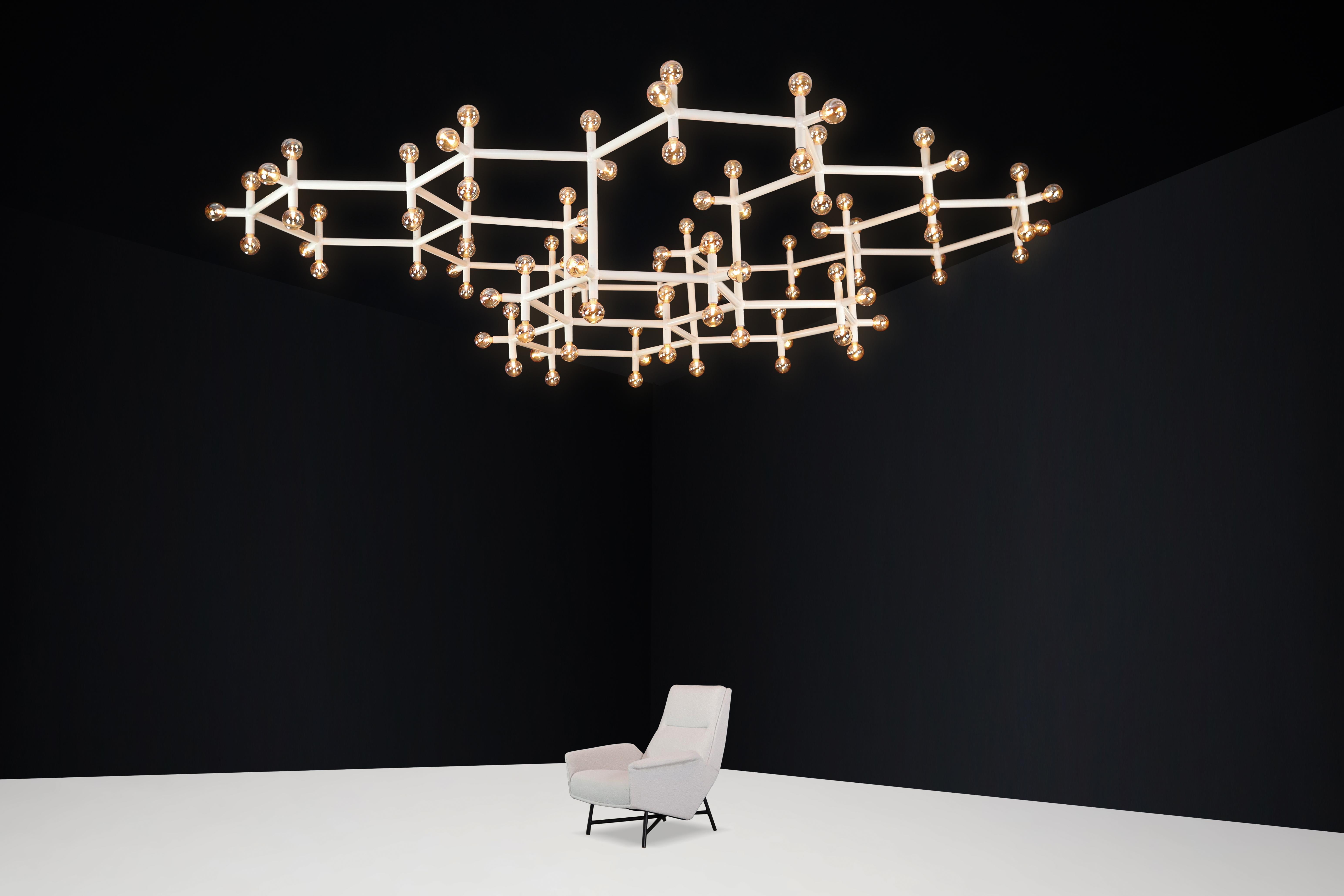 Robert Haussmann monumental atomic suspension chandelier, Switzerland, 1970s.

Monumental atomic suspension chandelier was designed by Robert and Trix Haussmann and manufactured by Swiss lamp, Switzerland, in the 1970s. The lamp is executed with