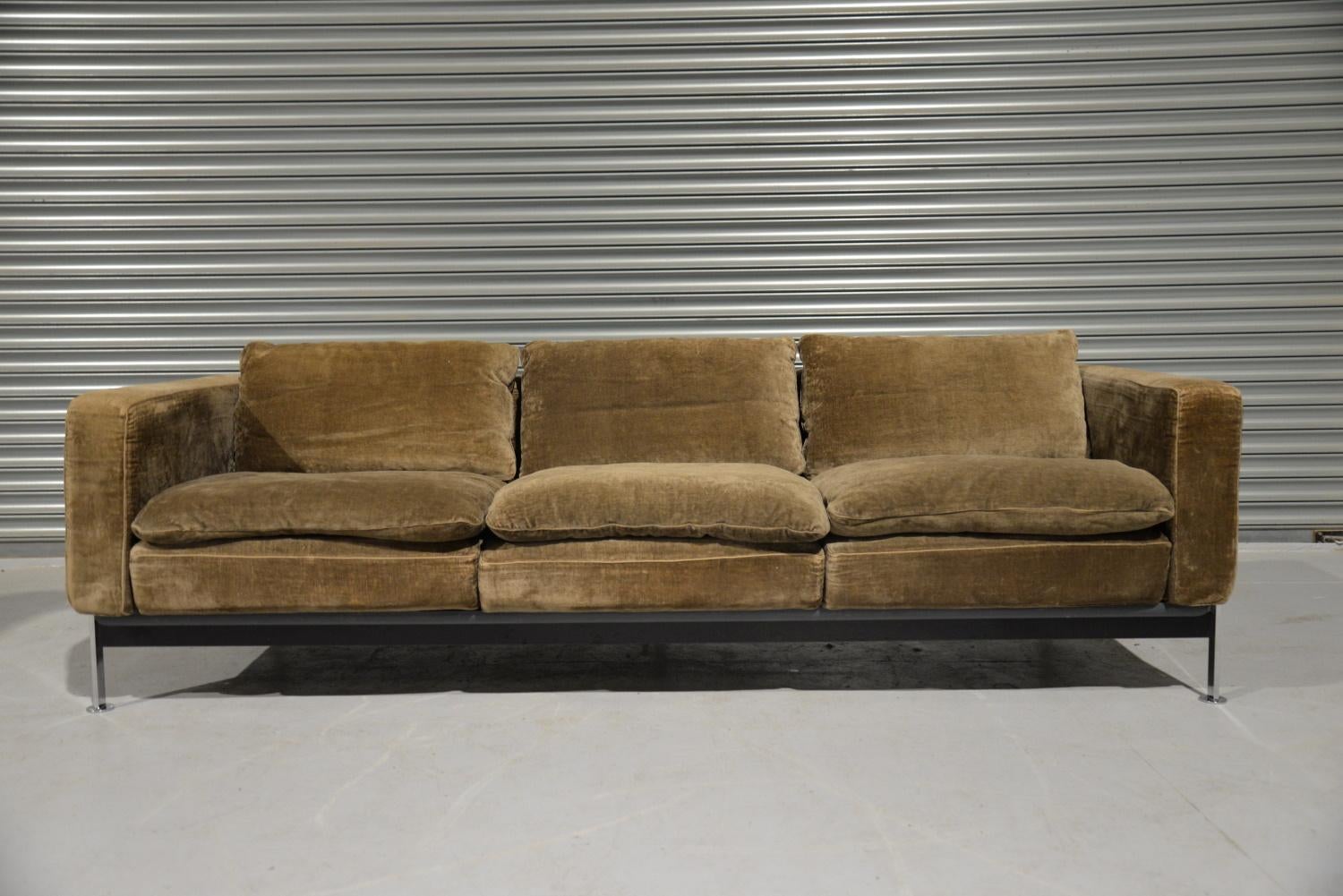 We are delighted to bring to you a highly coveted original Robert Haussmann De Sede RH 302 three seater sofa. These sofas are designed with a chromed plated iron frame that functions as a basket for the cushions making it extremely comforable. The