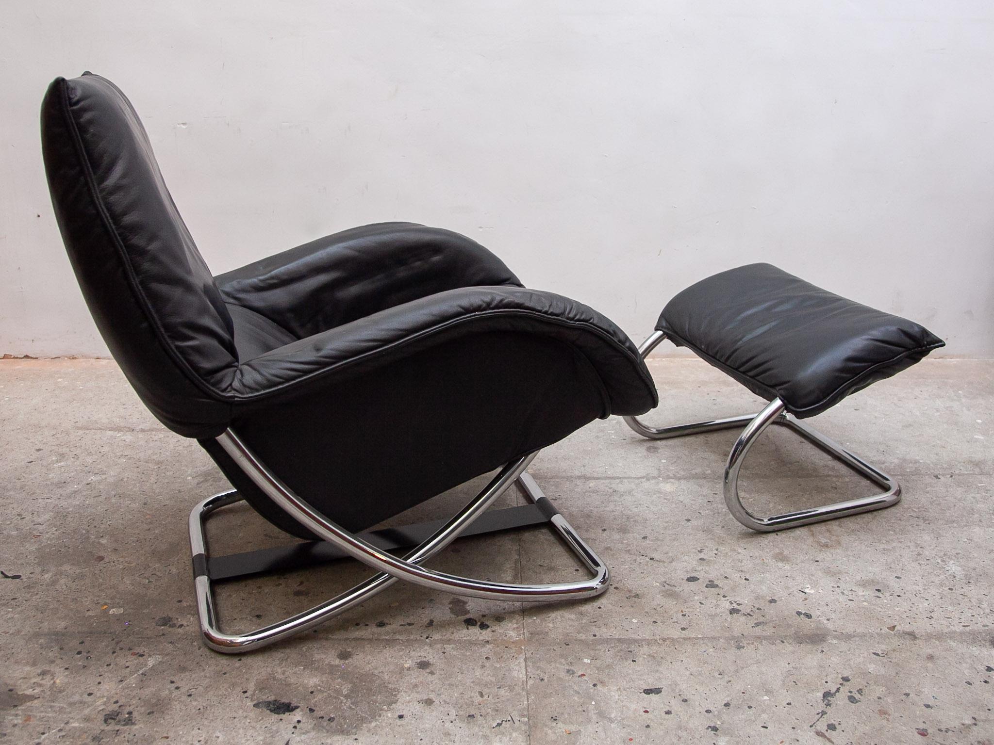 Beautifully designed comfortable chrome tube rocking lounge chair and ottoman, covered in soft black leather, Excellent condition.The chair is adjustable in various positions from sitting to lying down. A must have for relaxing in your interior or