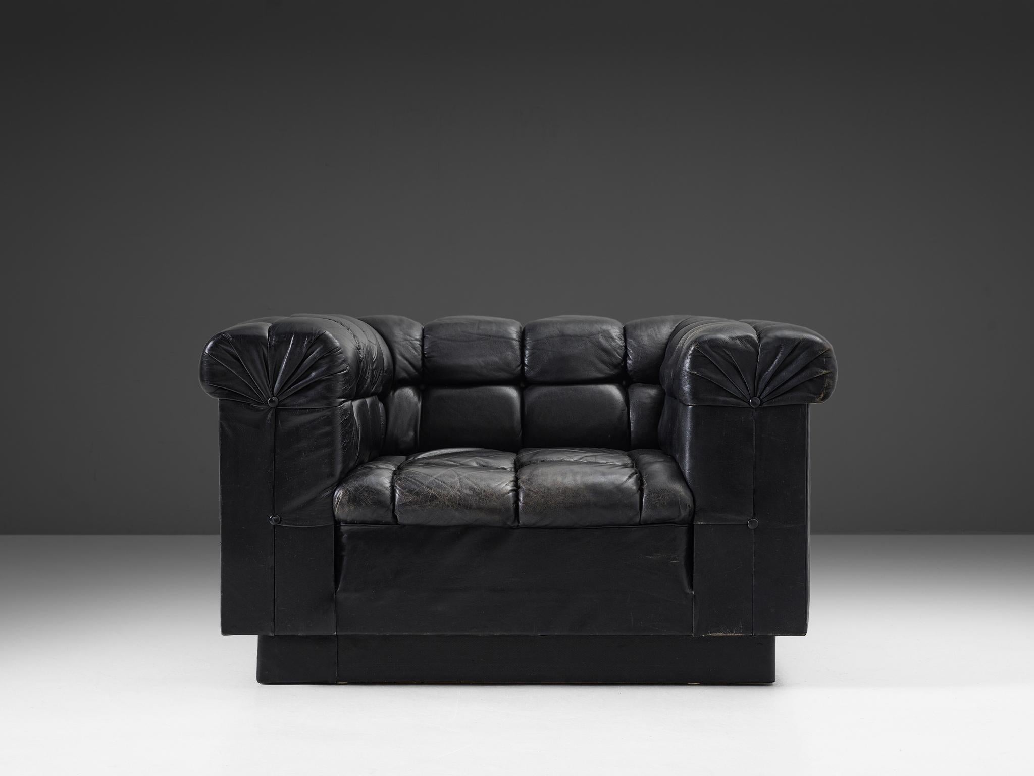 Robert Haussmann, lounge chair in leather, Switzerland, 1950s

Black leather lounge chair by Swiss designer Robert Haussmann. This easy chairs has an interesting appearance due to the expressive tufted details. The leather is separated by a