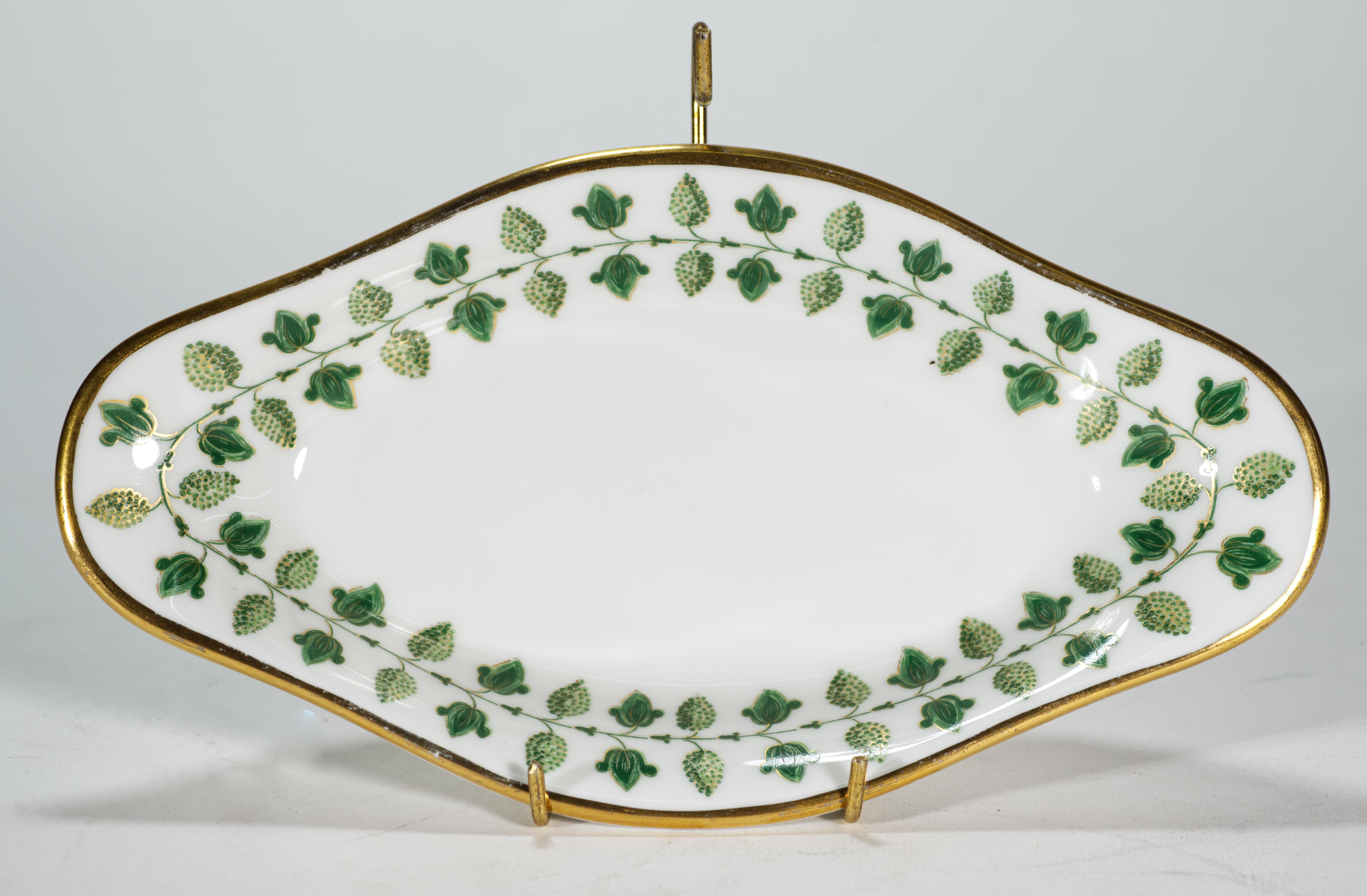 Vintage ravier dish or small tray is decorated in Matignon pattern in green colorway. While the iconic pattern is current and is still in production, this shape of a dish is not offered for sale on the official website or by the distributors, making