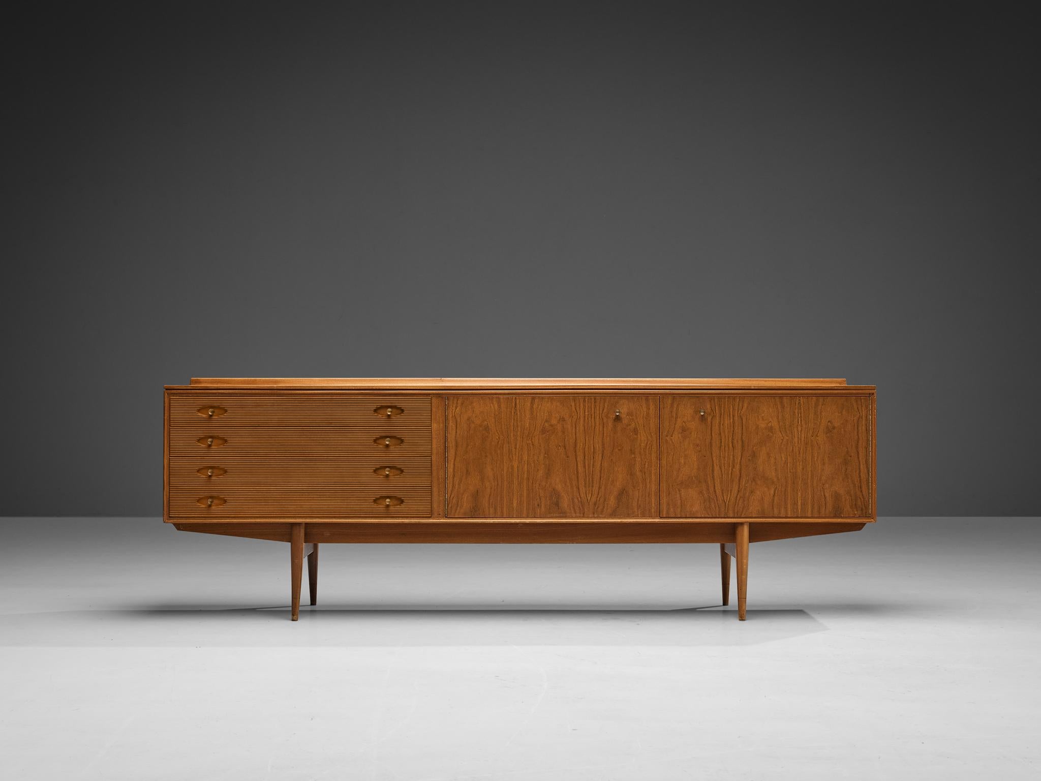 Robert Heritage for Archie Shine, sideboard ‘Hamilton’, walnut, brass, United Kingdom, 1957

This beautifully designed piece won a coveted Design award selected by the British Design Council ‘Designs of the Year’, together with twenty other designs,