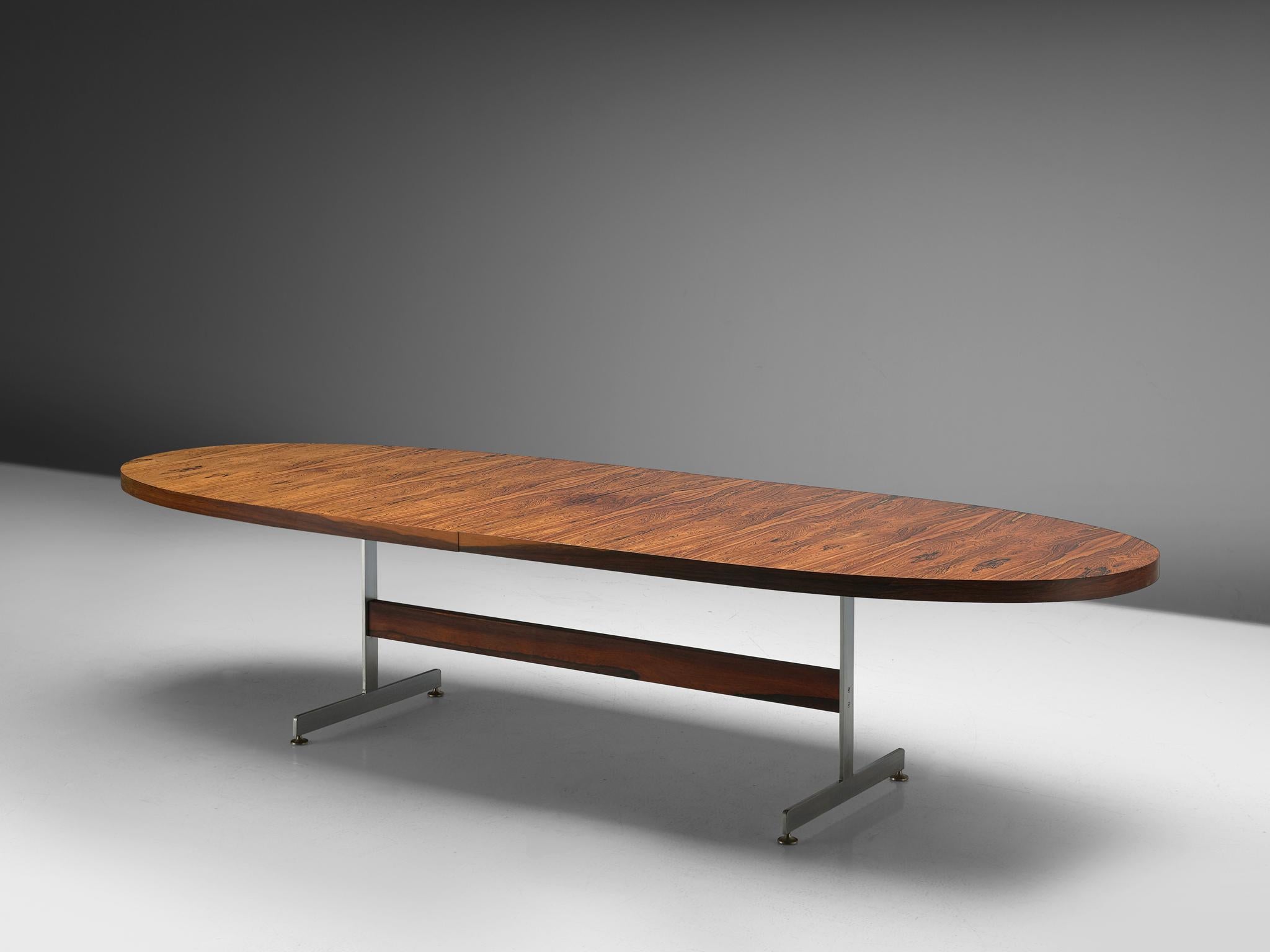 Robert Heritage for Archie Shine, conference table, rosewood and metal, United Kingdom, 1960s

A large oval rosewood table designed by Robert Heritage in the 1960s. The top is supported by metal chromed legs and with a wooden cross stretcher. It's