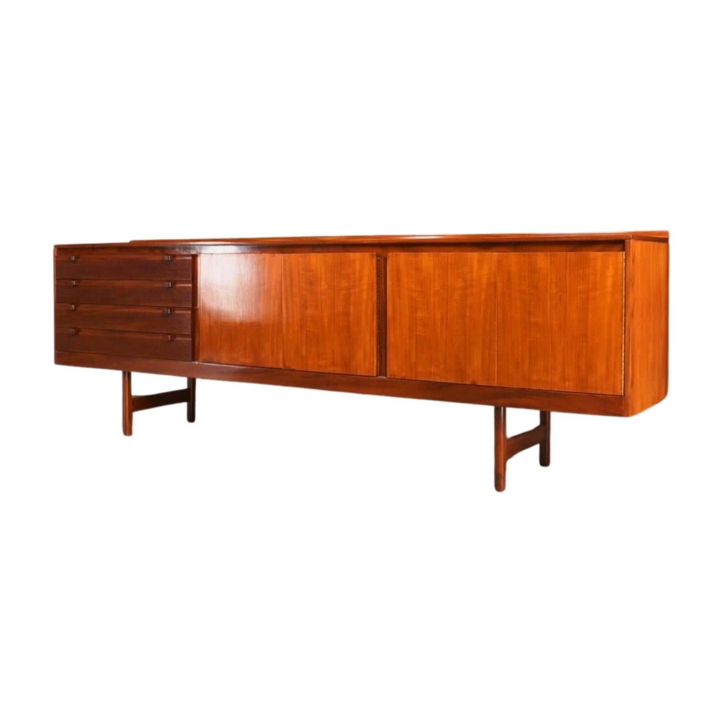 Robert Heritage for Archie Shine Sideboard: This sideboard by Robert Heritage for Archie Shine, crafted in the 1960s, is a classic piece of mid-century modern design. The wood and metal construction offer both style and functionality. Perfect for