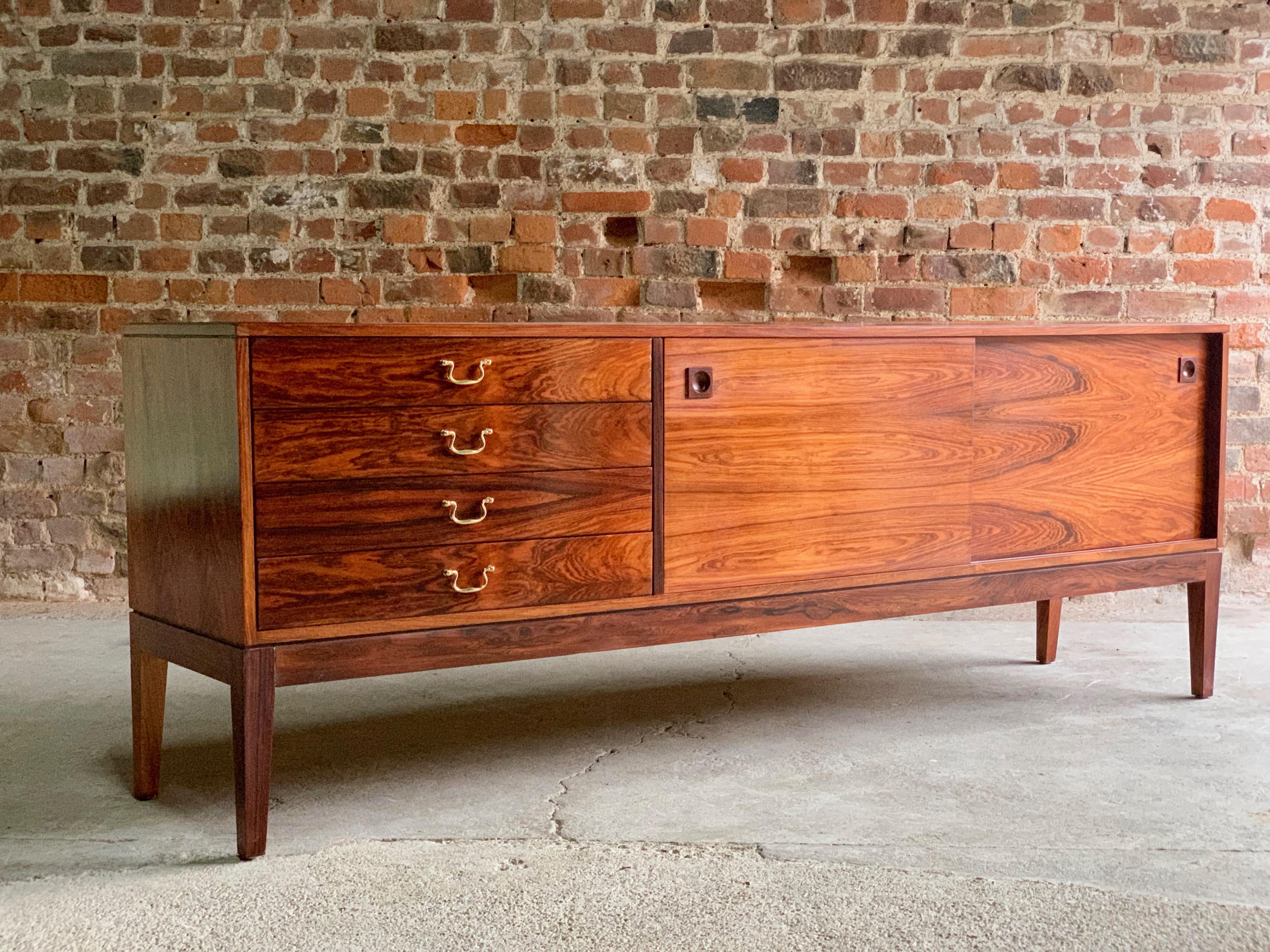 Robert Heritage rosewood sideboard for Archie Shine Retailed by Harrods, circa 1960

Robert Heritage design for Archie Shine rosewood sideboard credenza retailed through Harrods circa 1970, The rectangular top over four drawers to the left (top