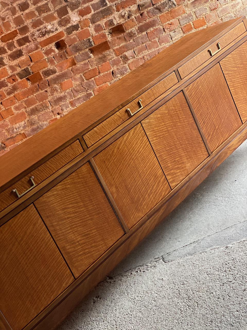 A Stunning midcentury, super rare Robert Heritage golden walnut & Afromosia (African Teak) credenza manufactured by Archie Shine and retailed through Harrods, London Circa 1960, the figured rectangular top over three large drawers constructed from