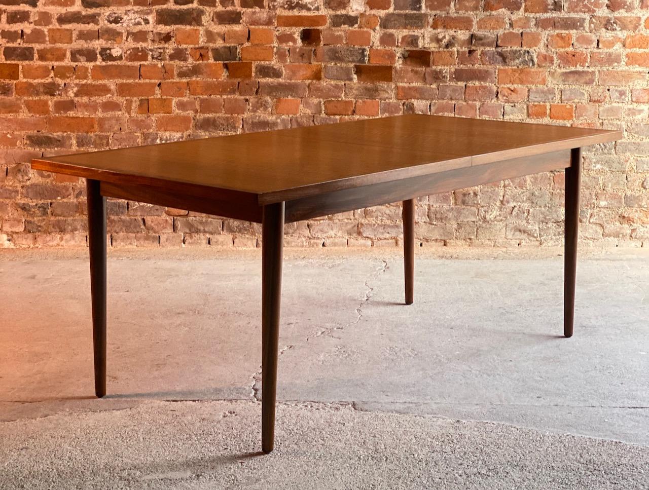 Robert Heritage walnut and teak dining table for Archie Shine, circa 1960

A stunning Midcentury Robert Heritage walnut & Afromosia (African Teak) Dining Table manufactured by Archie Shine and retailed through Harrods, London Circa 1960, the