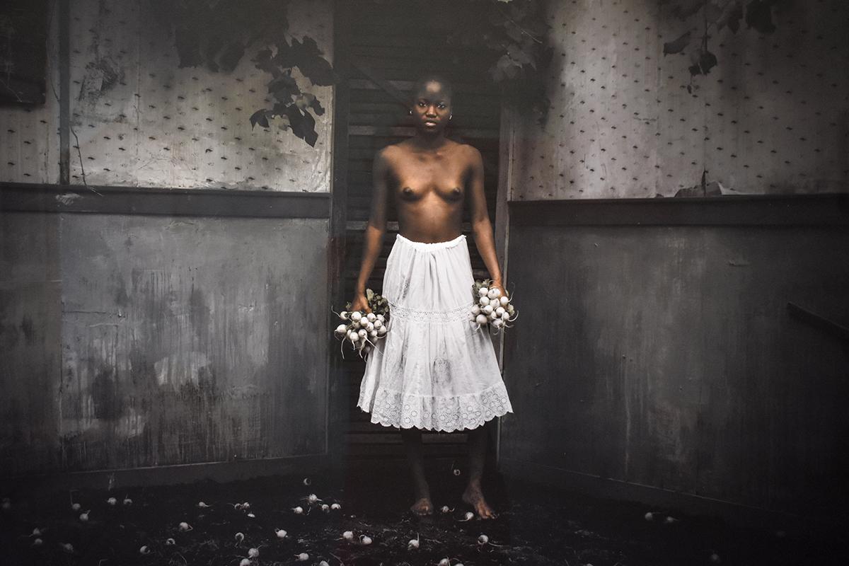 Figurative photograph of a topless woman in an eerie old-fashioned interior
archival pigment print, edition of 10 
30 x 40 inches, 39 x 49 inches in dark grey painted wood frame with 8-ply mat and non-glare glass

This contemporary figurative