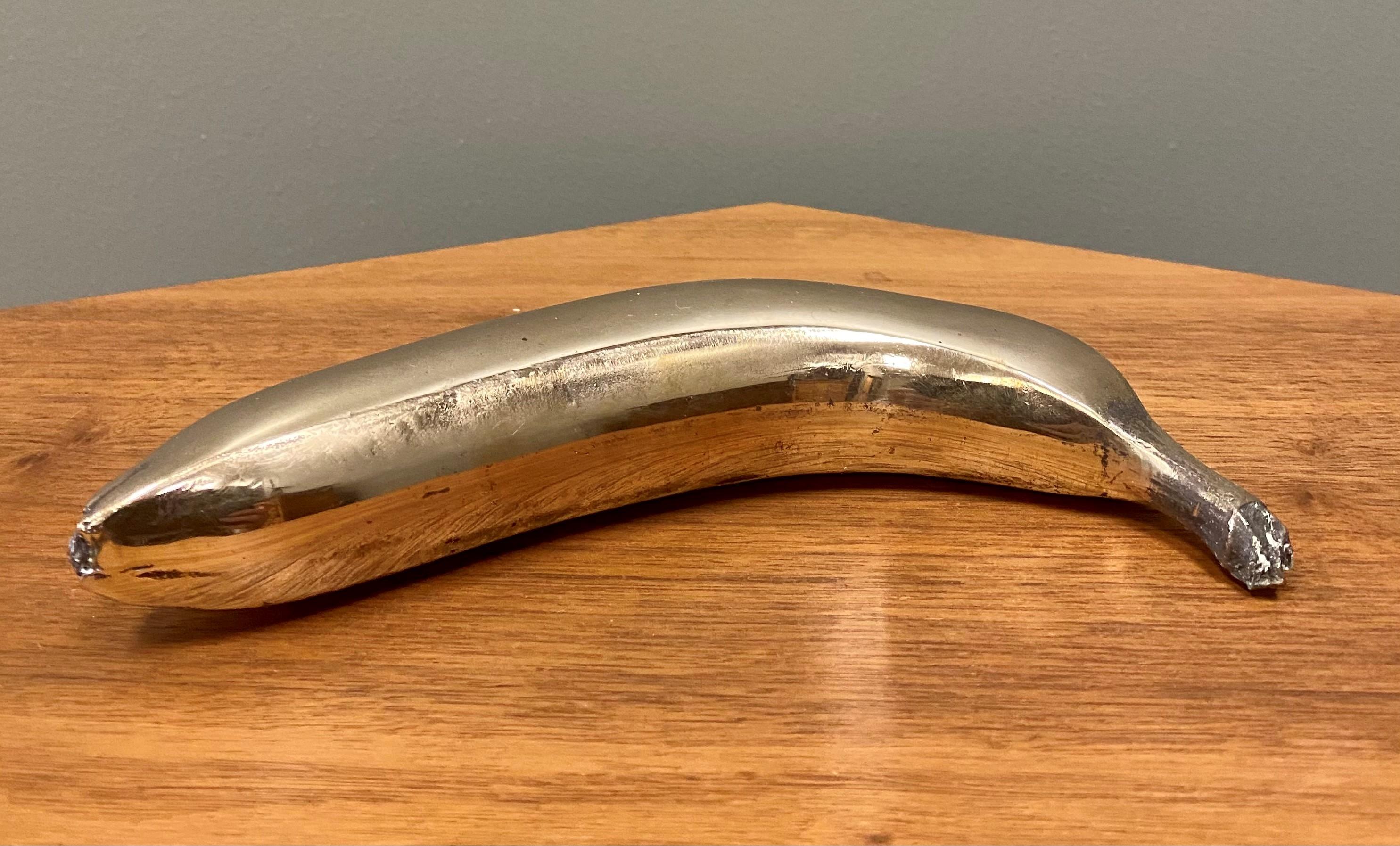 Robert Holmes Figurative Sculpture - Banana, High Polish