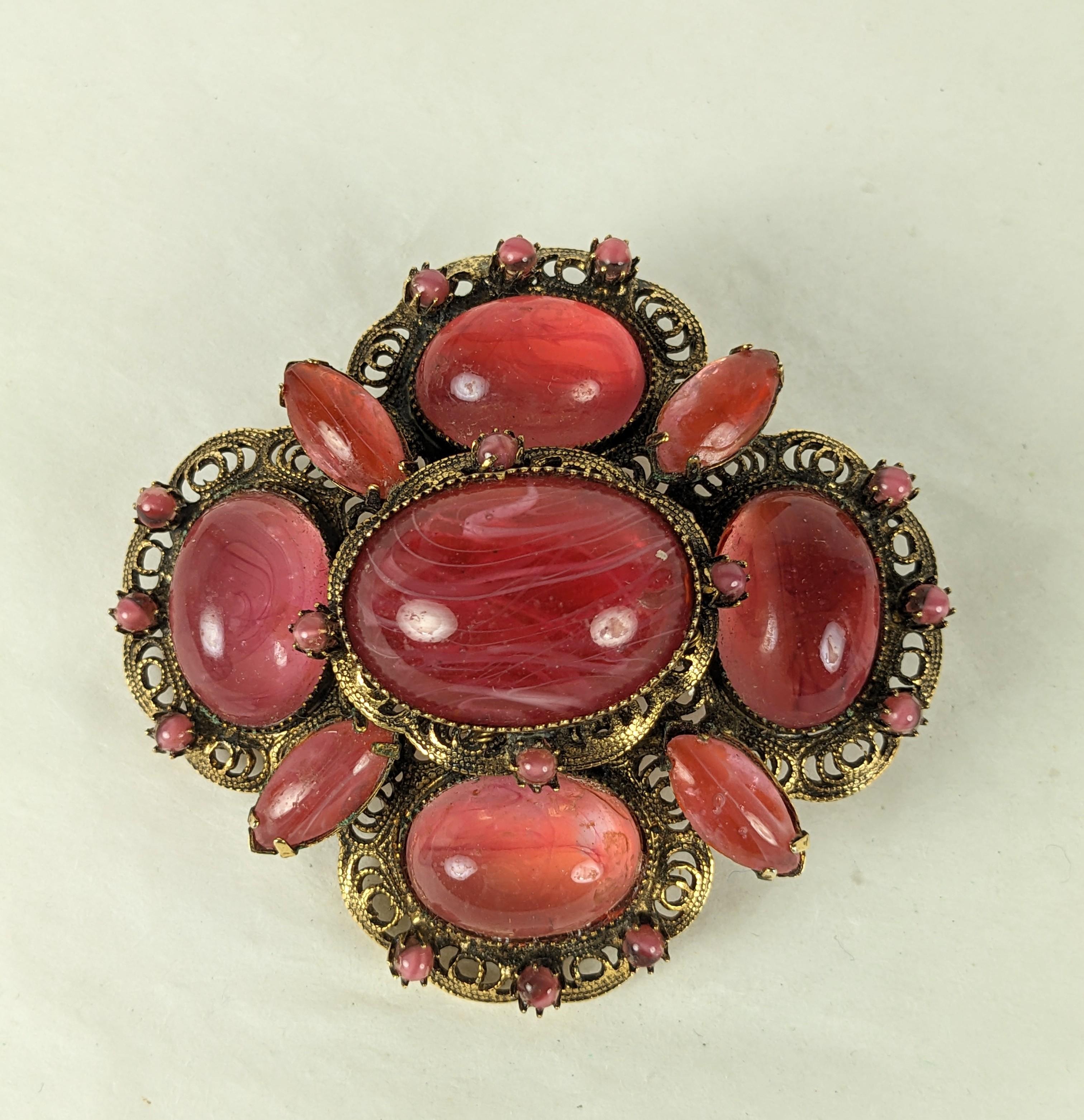 Striking Robert Jeweled Filigree Brooch from the 1950's. Orangey rose quartz colored cabochons set in antique filigree metal. 2.5