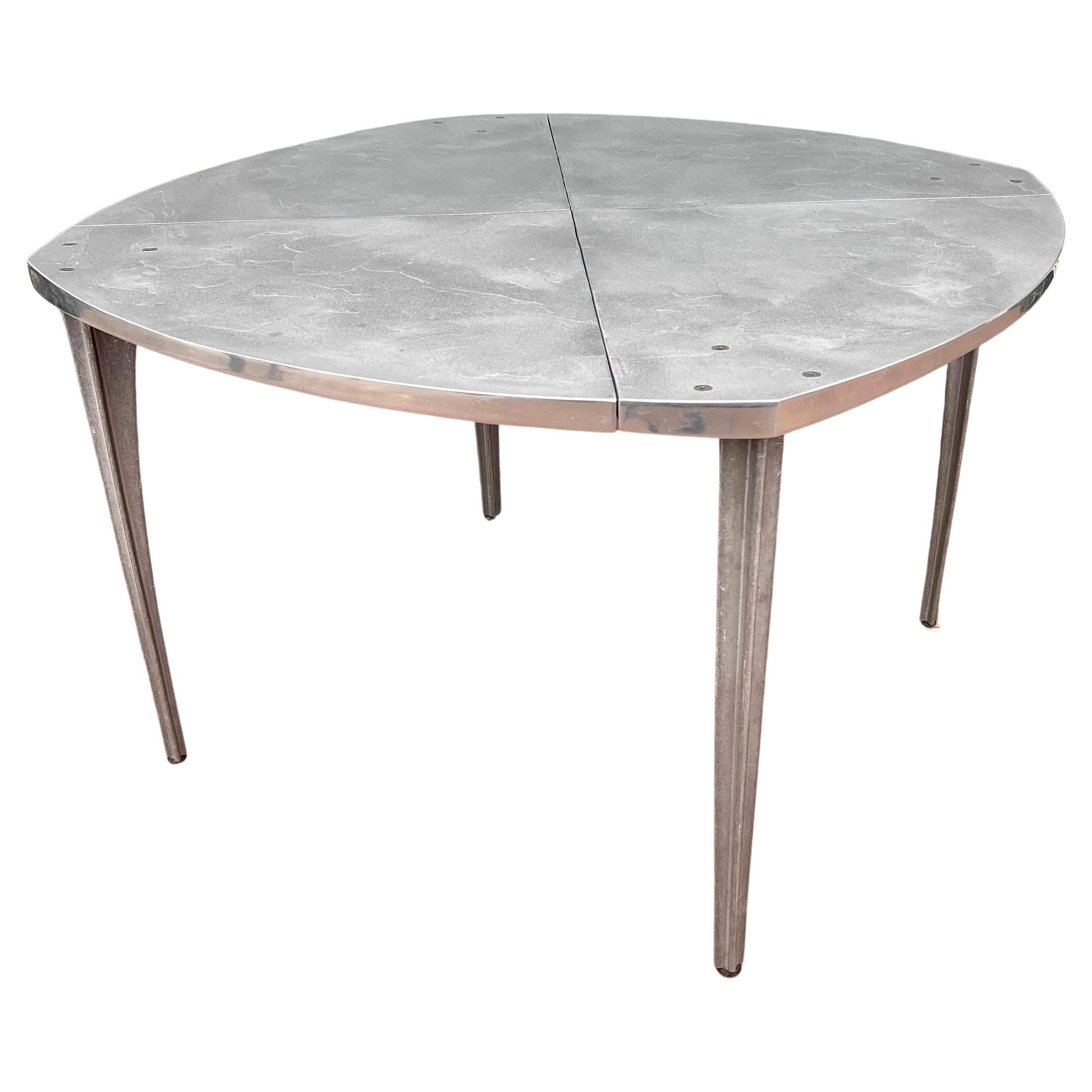 Rare dining table by Robert Josten solid raw patinated steel top with cast aluminum legs circa the 1980s, all in original condition very unusual to see this table, his designs are scarce and this one is very rare and perfect for a dining table.