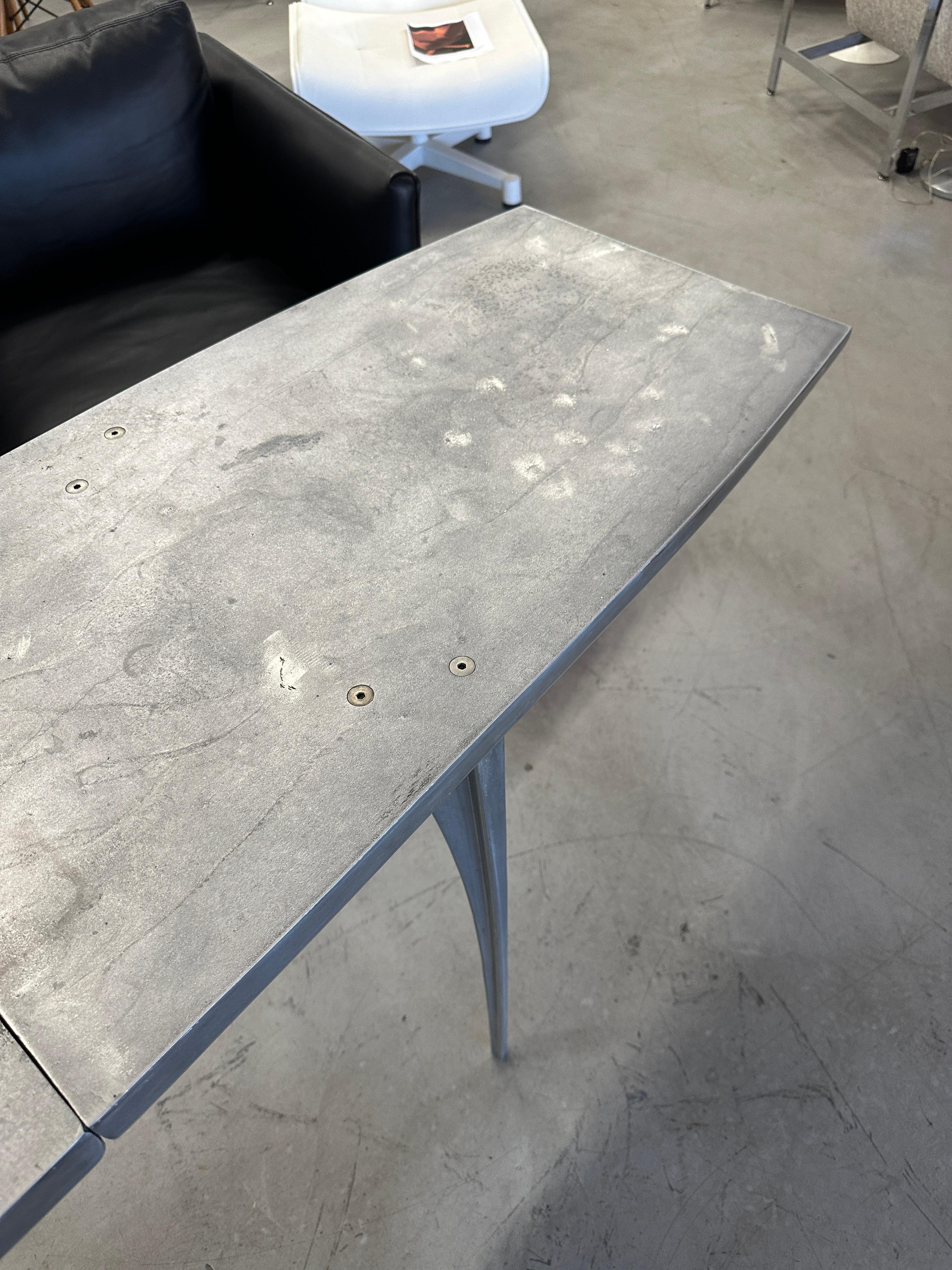 Wonderful Sculptural aluminum console or sofa table by the noted Californian Robert Josten. We found this table in an outdoor setting in a lovely Palm Springs estate. As it is solid aluminum it will not rust and can be polished to a high luster if