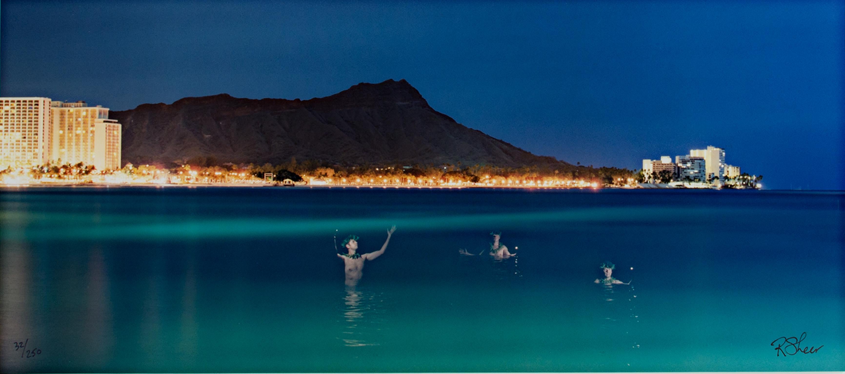 "Three Hawaiian Spirits at Waikiki" is an original fine-art chromogenic photograph by Robert Kawika Sheer. The image is signed in the lower right and editioned in the lower left. Edition: 32/250. The image depicts the ocean, all in shades of blue