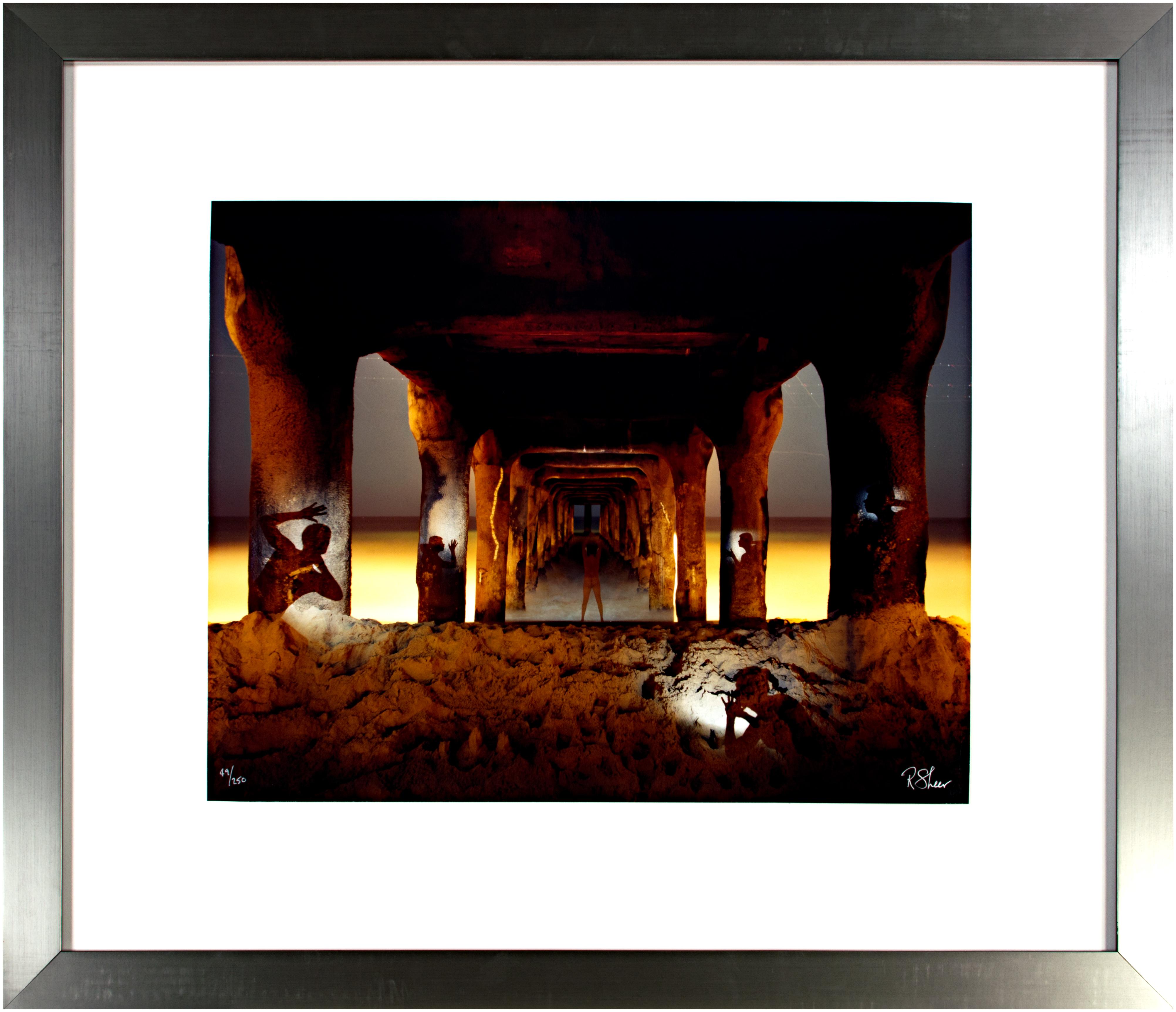 'Under the Manhattan Beach Pier No. 1' exemplifies the long-exposure photography of Robert Kawika Sheer. The artist signed this piece in the lower right and editioned in the lower left. Edition: 49/250. Sheer has the camera looking down the long
