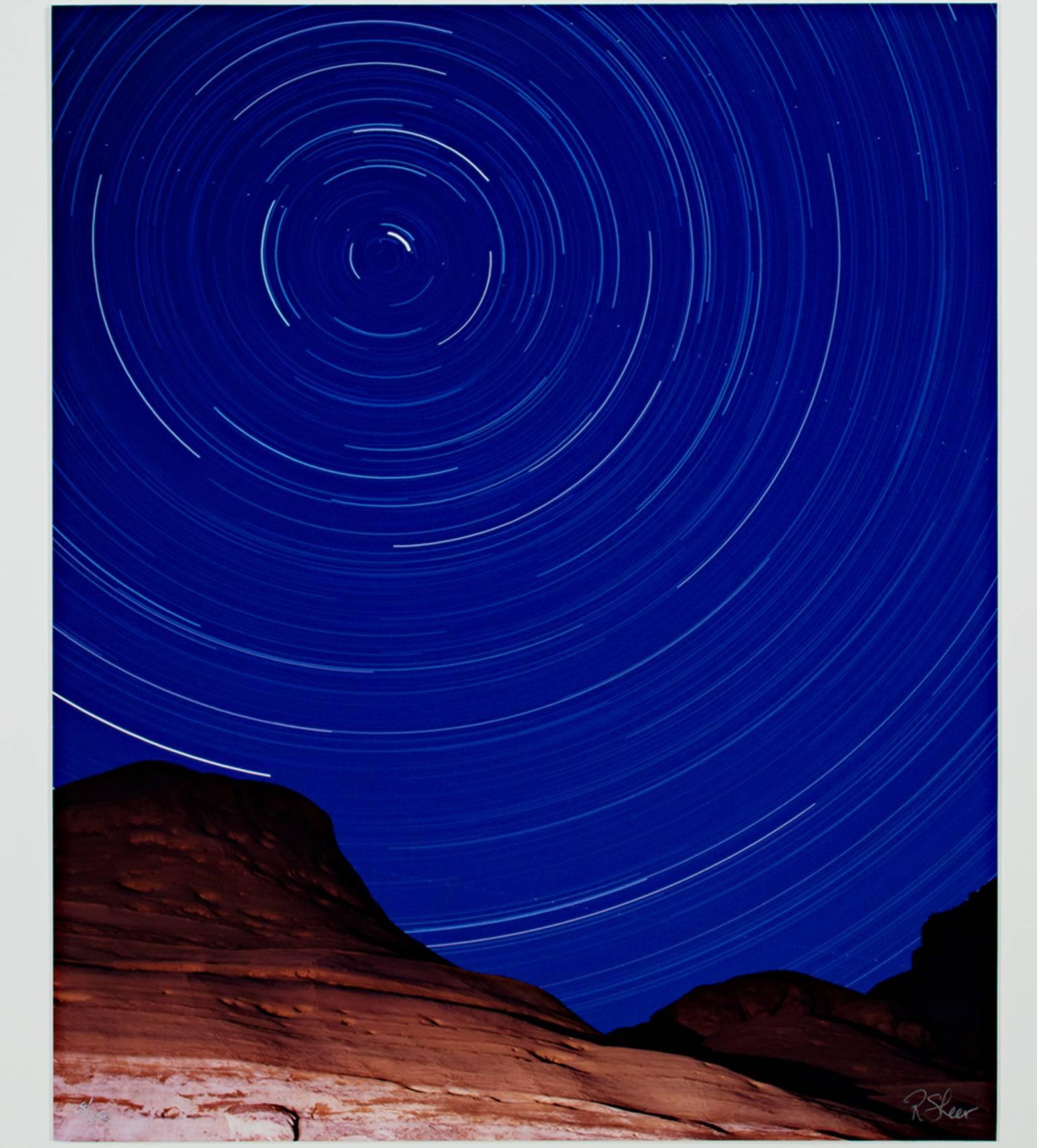 "Lake Powell Star Circles-North Star" is a long-exposure photograph by Robert Kawika Sheer. The artist signed this piece in the lower right and editioned in the lower left. Edition 28/250. This photograph depicts the stars as they circle around the