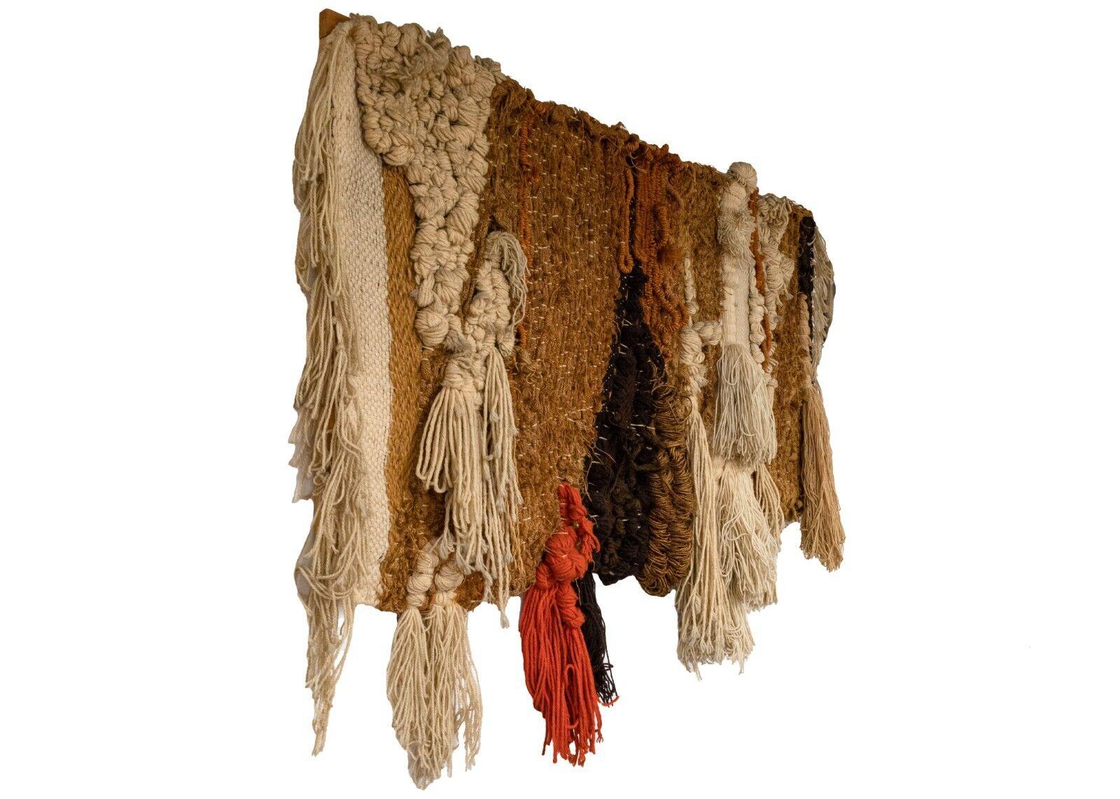 A magnificent, handwoven, abstract fiber wall art made with wool yarn, by Robert Kidd, circa 1970s. This textural art piece in brown earth tones and retro orange makes a unique statement artwork for a modern or contemporary designed space.